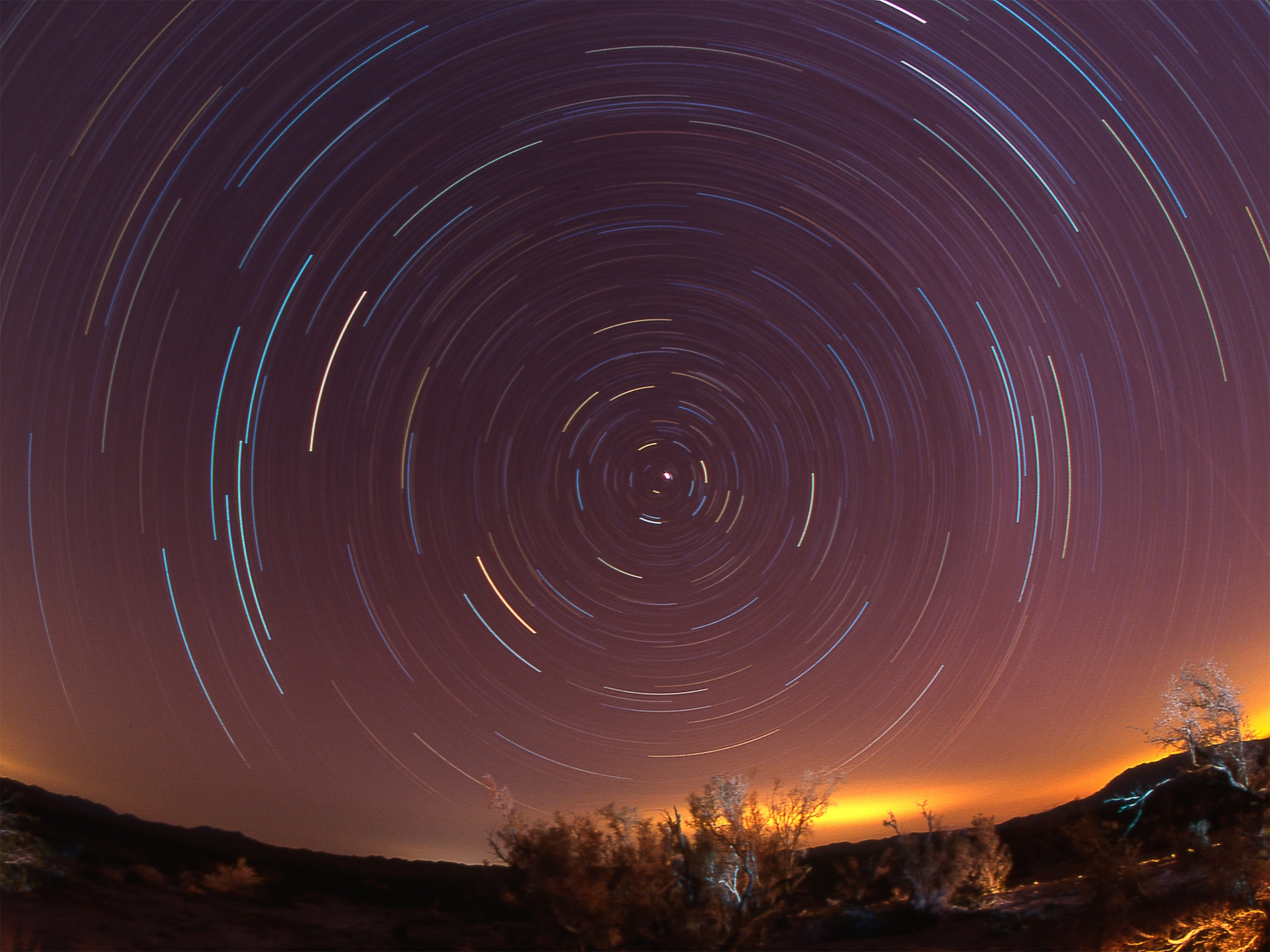 The North Star, Polaris, as seen in a star-trail photograph above California.