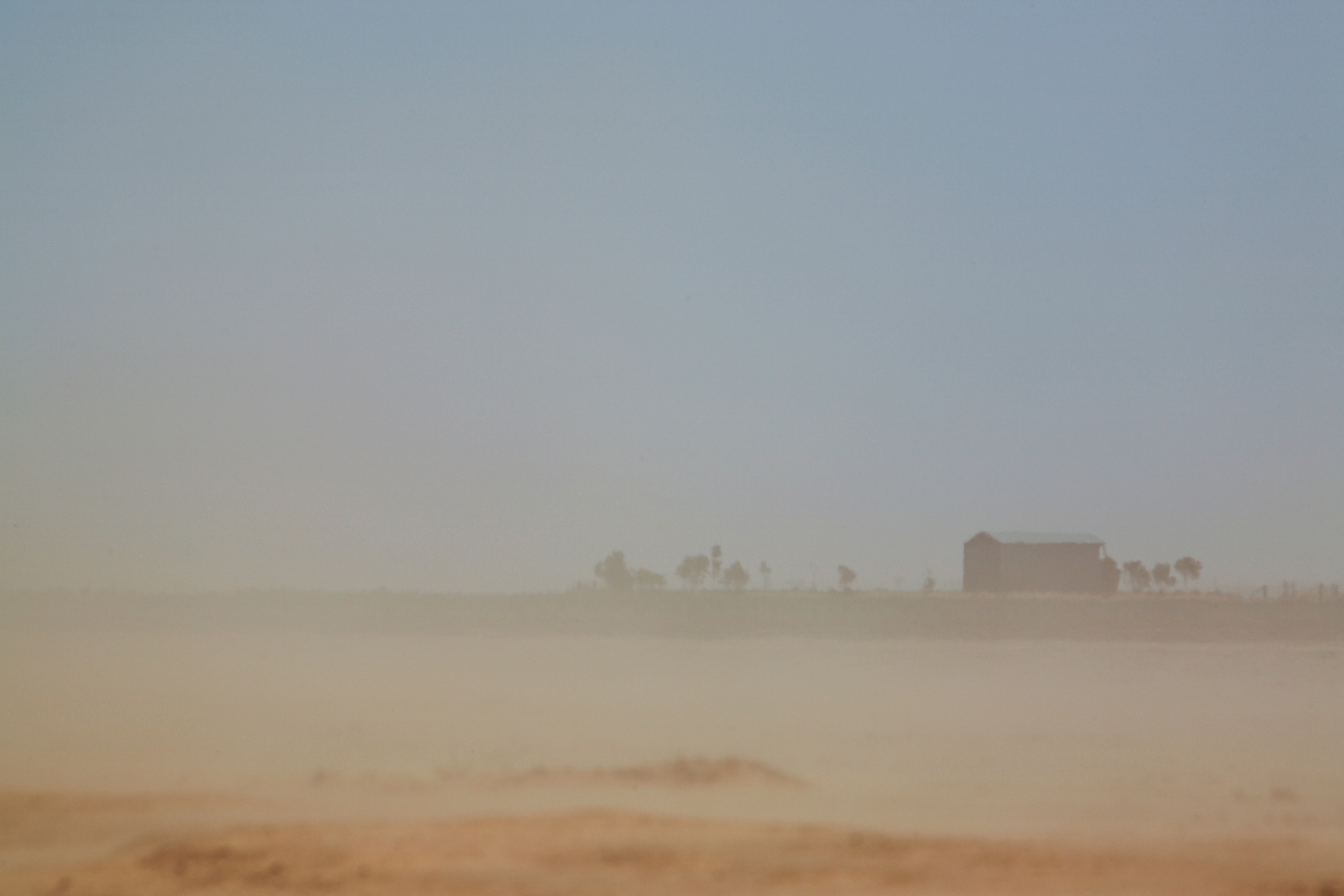 dust and wind blasting the Booth family farm