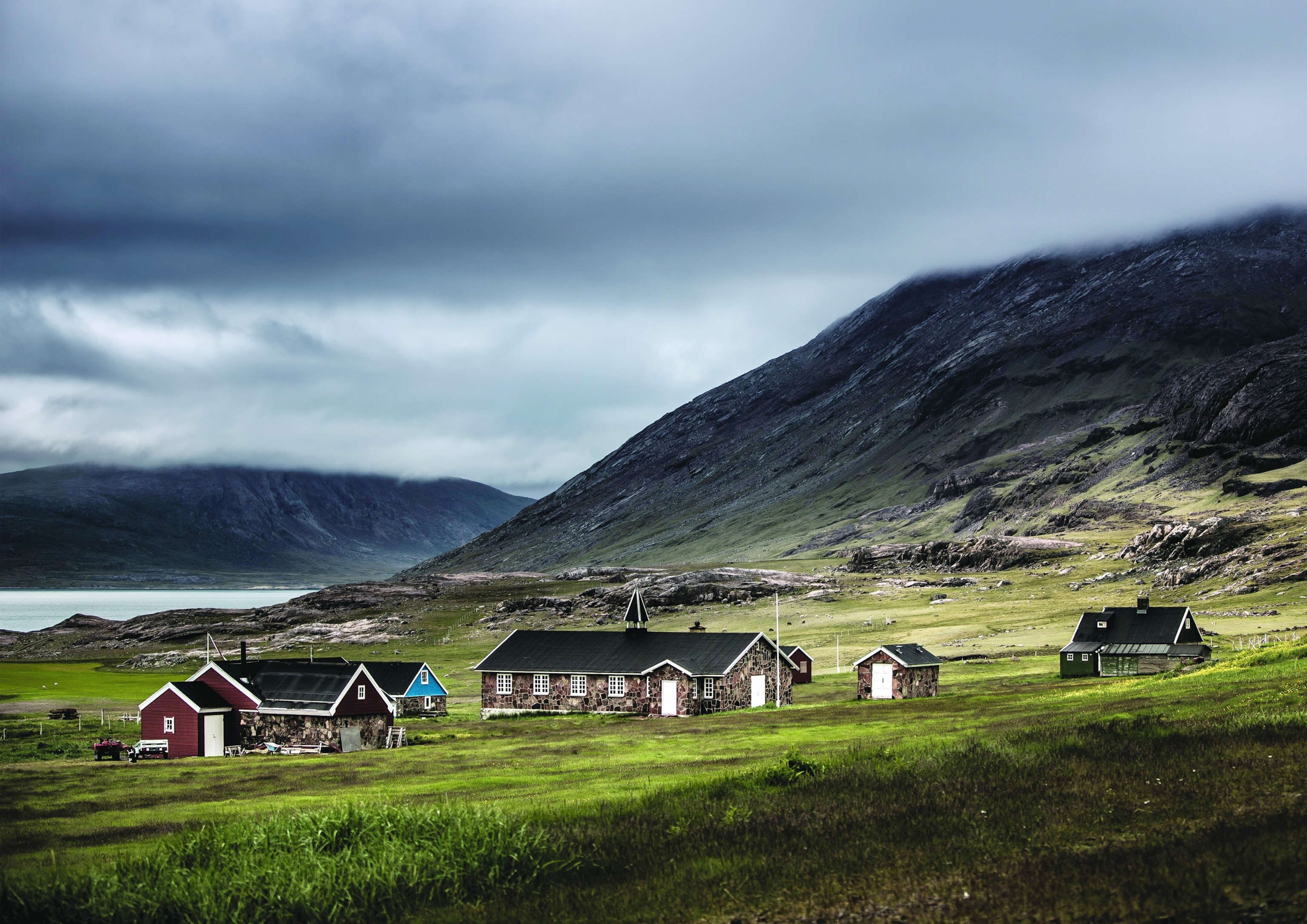 a view of houses and church at the settlement of Igaliku