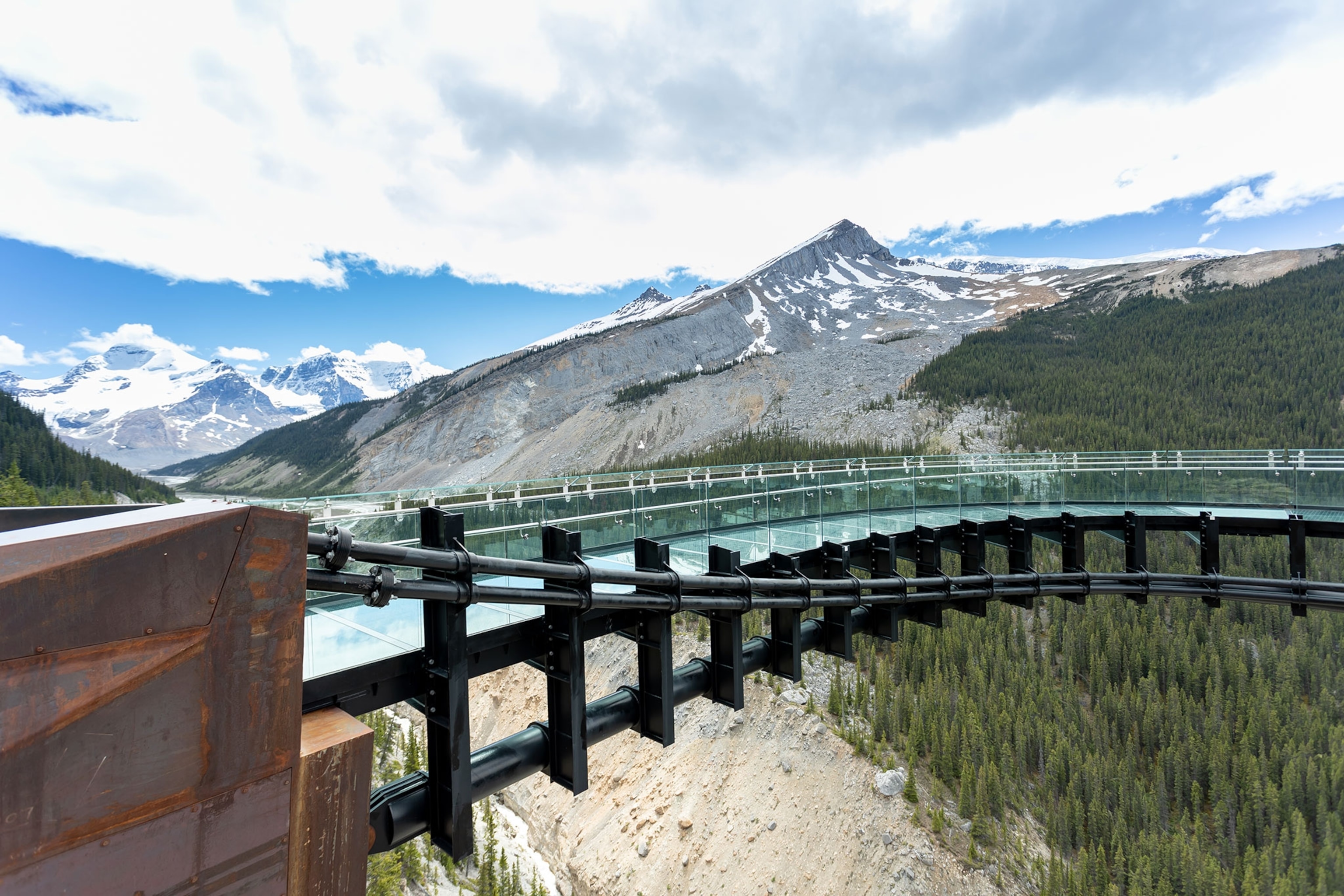 Columbia Icefield Skywalk During Summer in Jasper National Park. The footpath is empty which is very rare but with the Covid-19 pandemic, less people are traveling. It is a beautiful sunny day. The view on the glacier is majestic.