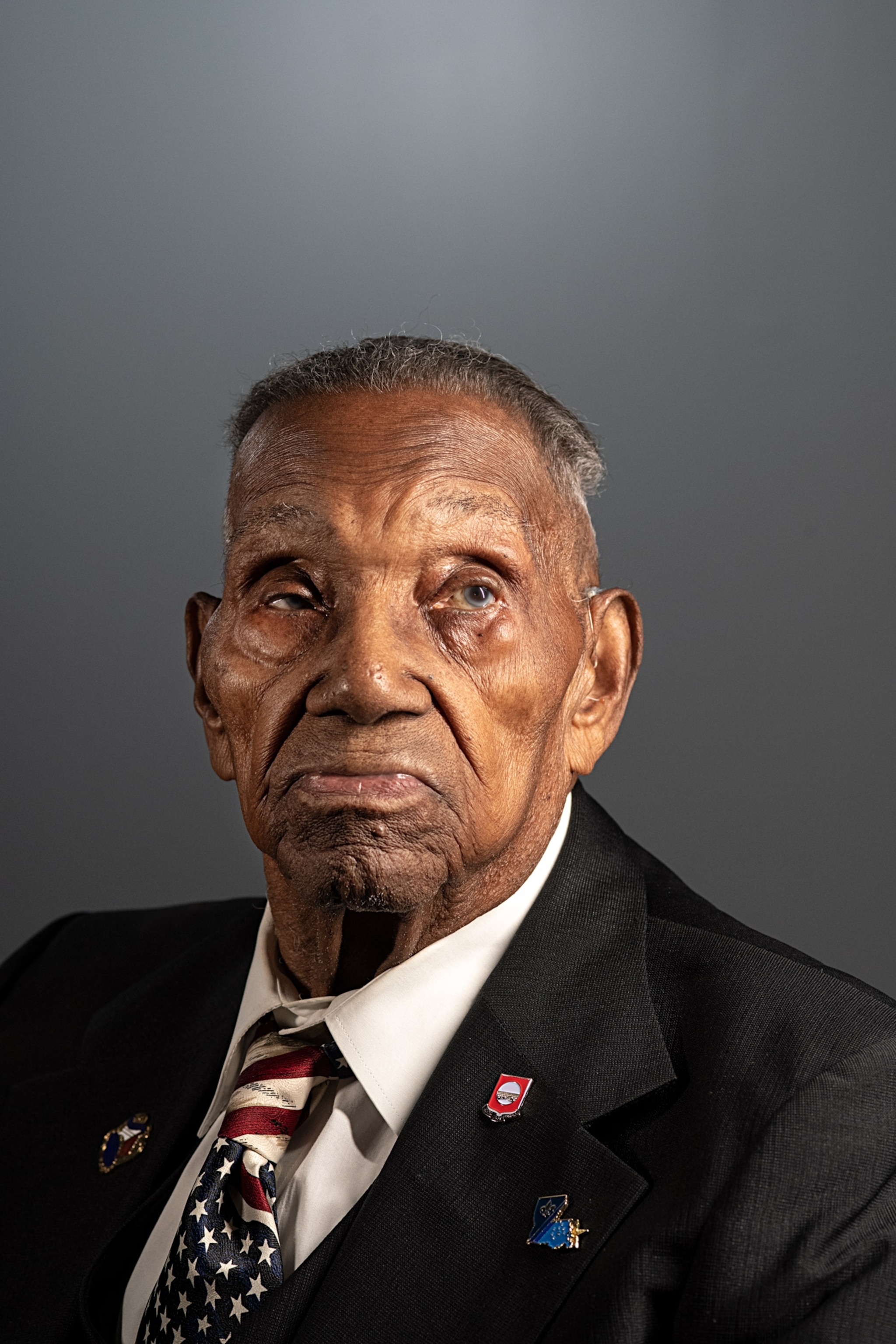 an older man standing for a portrait