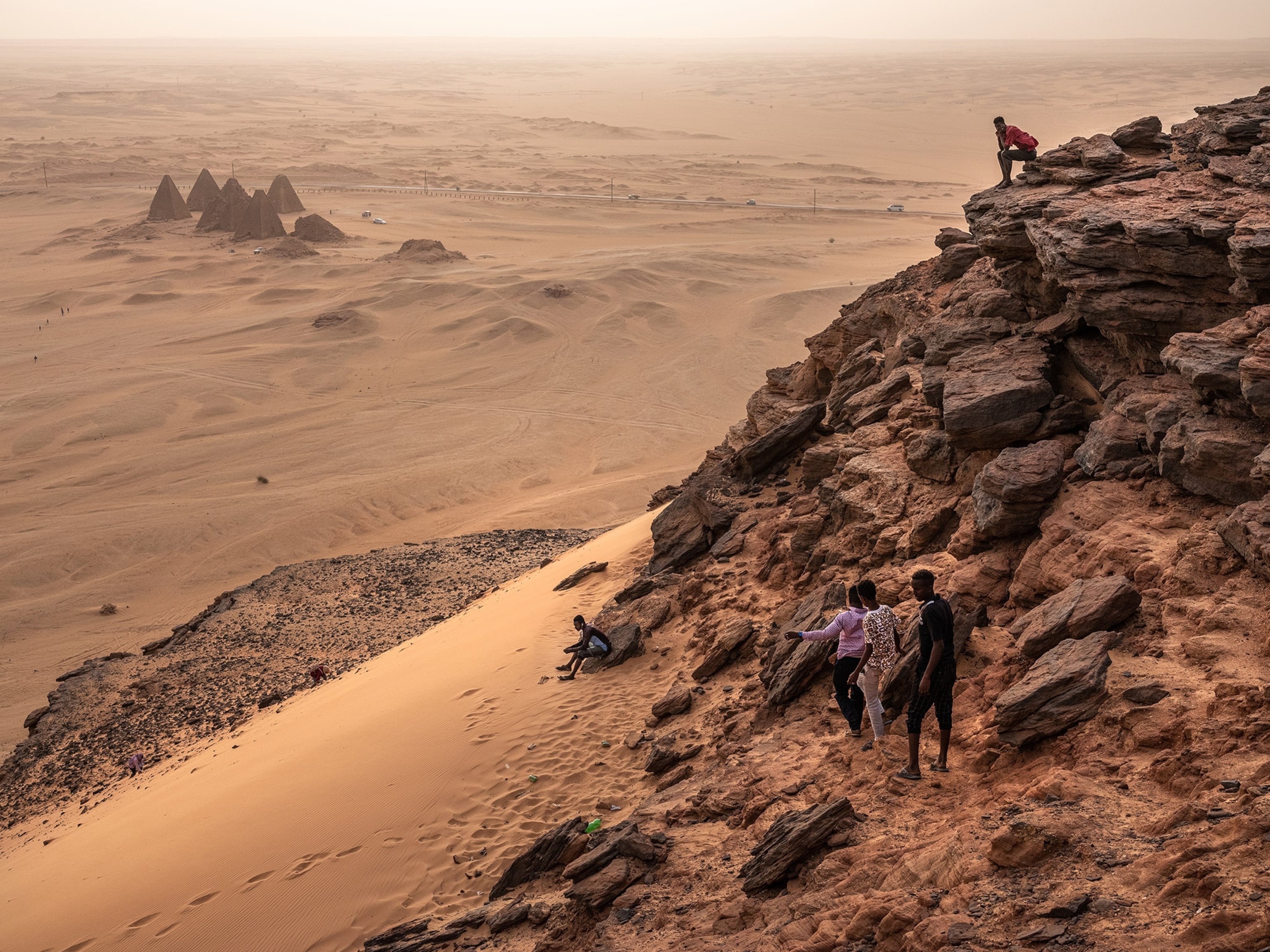 Sudanese tourists visit Jebel Barkal, Sudan, to climb the small butte that has been considered sacred for thousands of years