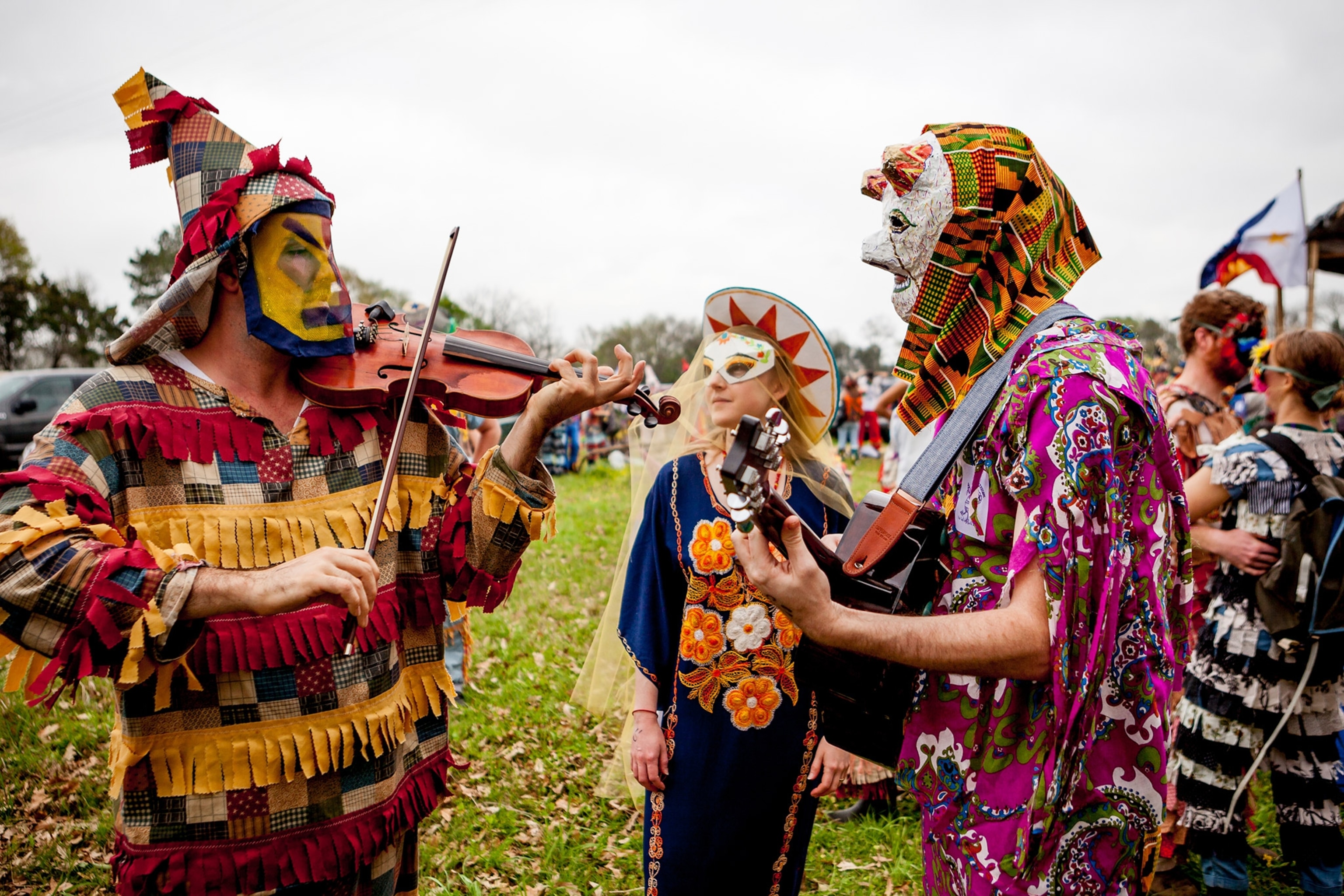 people playing musical instruments at the Courir de Mardi Gras celebration in Louisiana