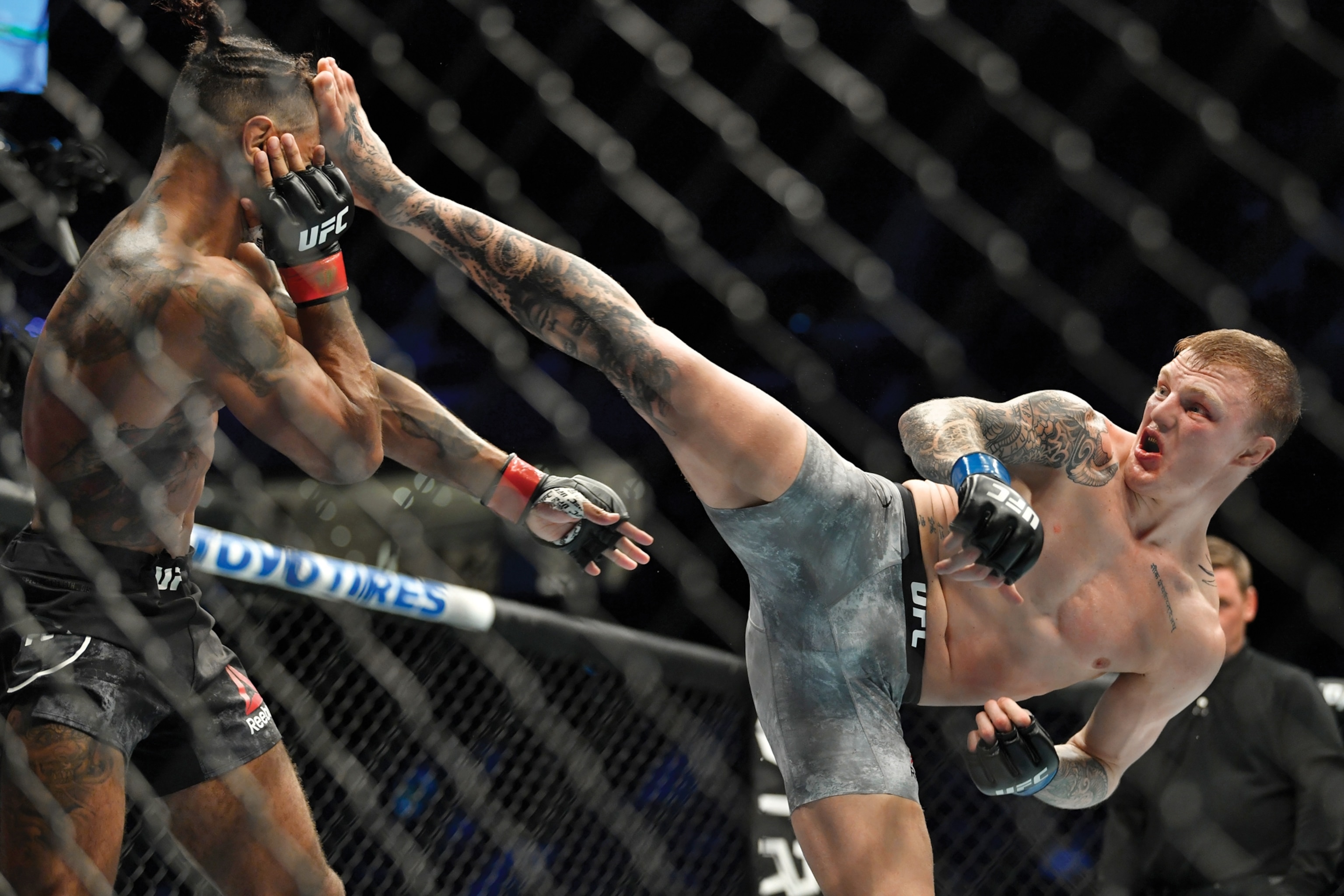 Picture of man kicking another man into face.