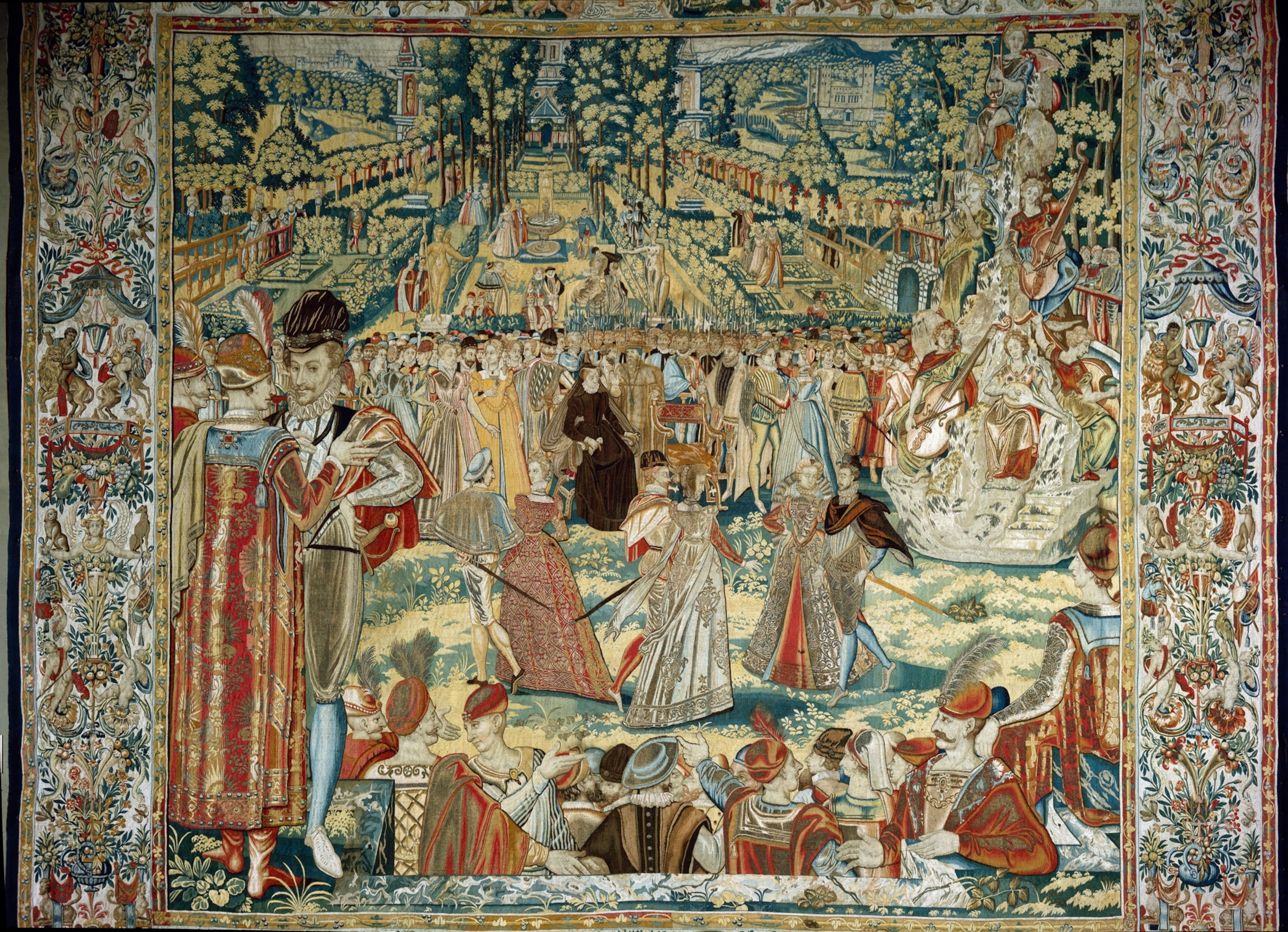 A colorful tapestry in a garden with a variety of people.