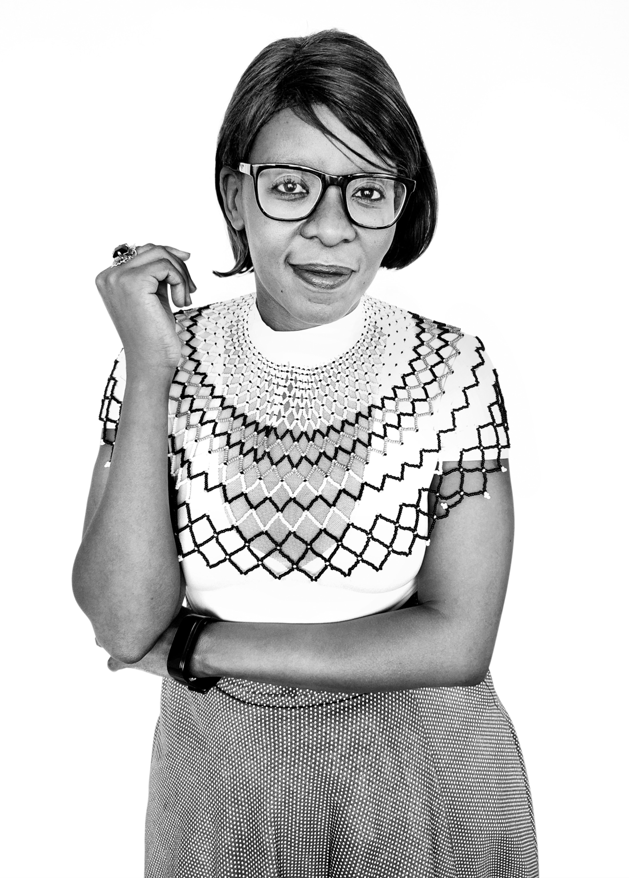 Woman in eyeglasses with a ring on her right hand.