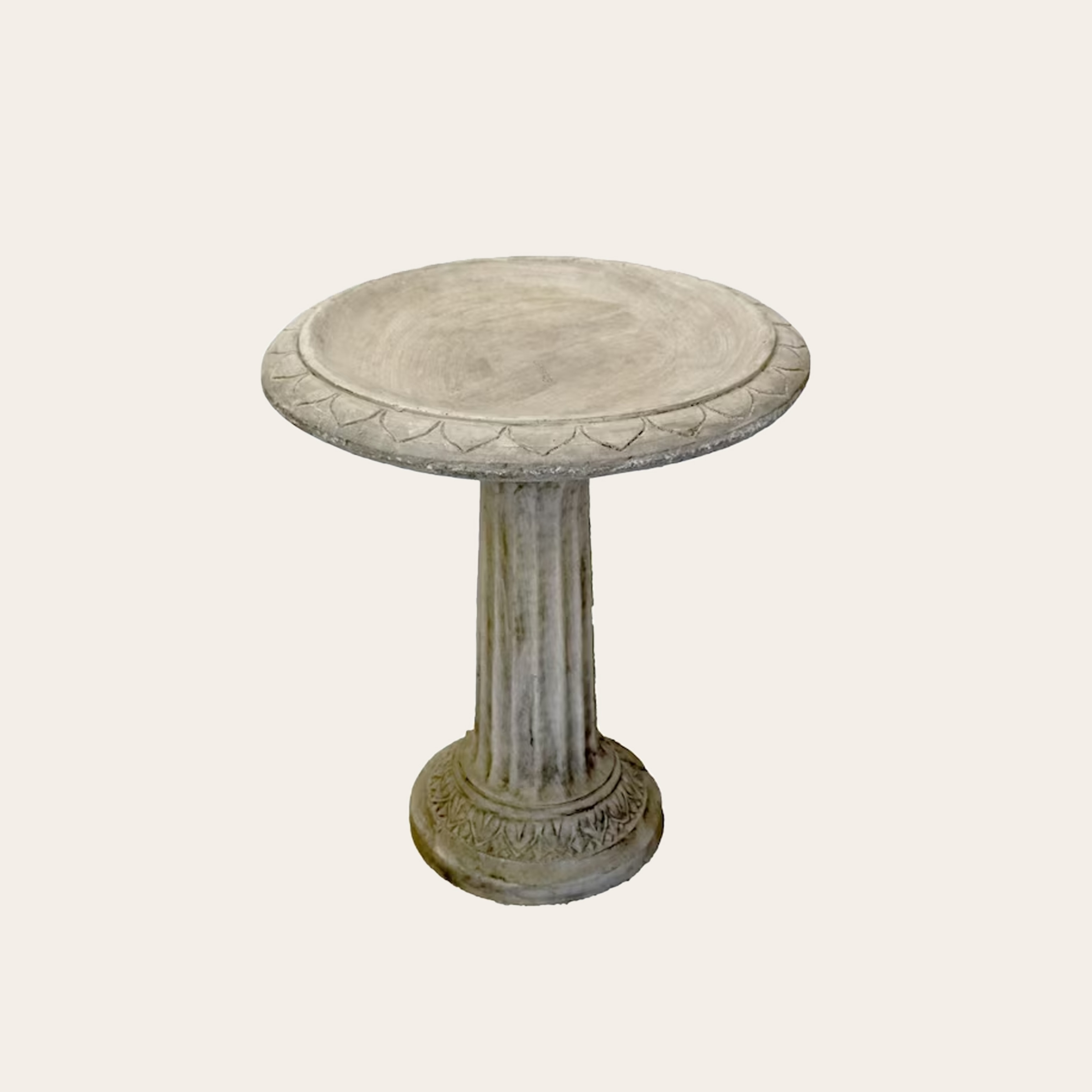 An image of a concrete bird bath.