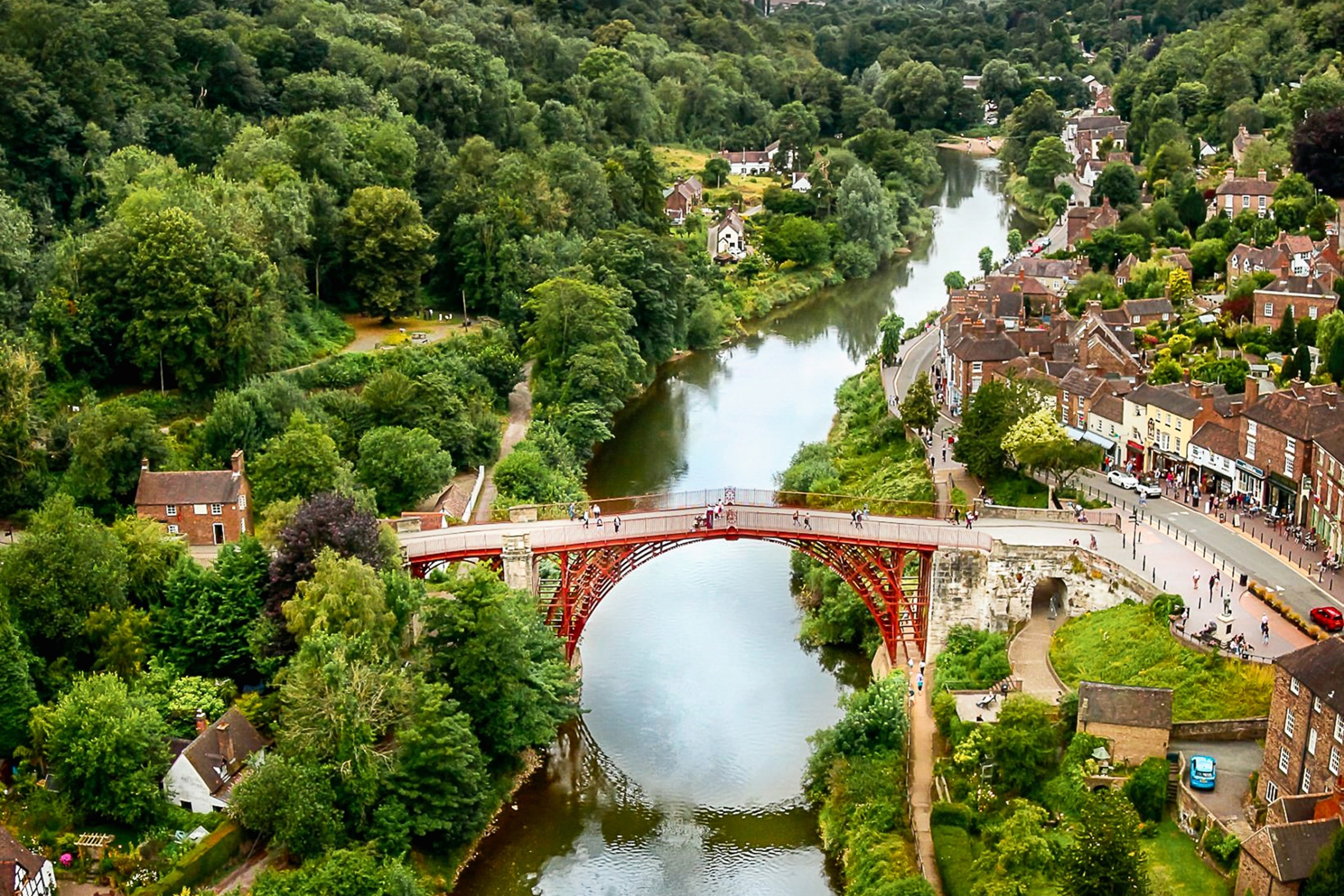 A view of Iron Bridge reflecting in the water.