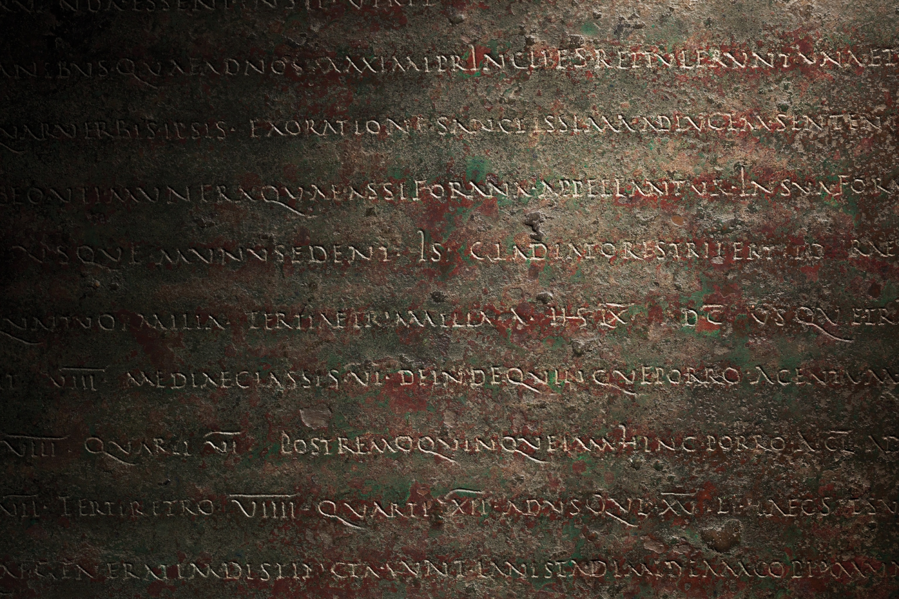 Picture of bronze plaque with hand written text.
