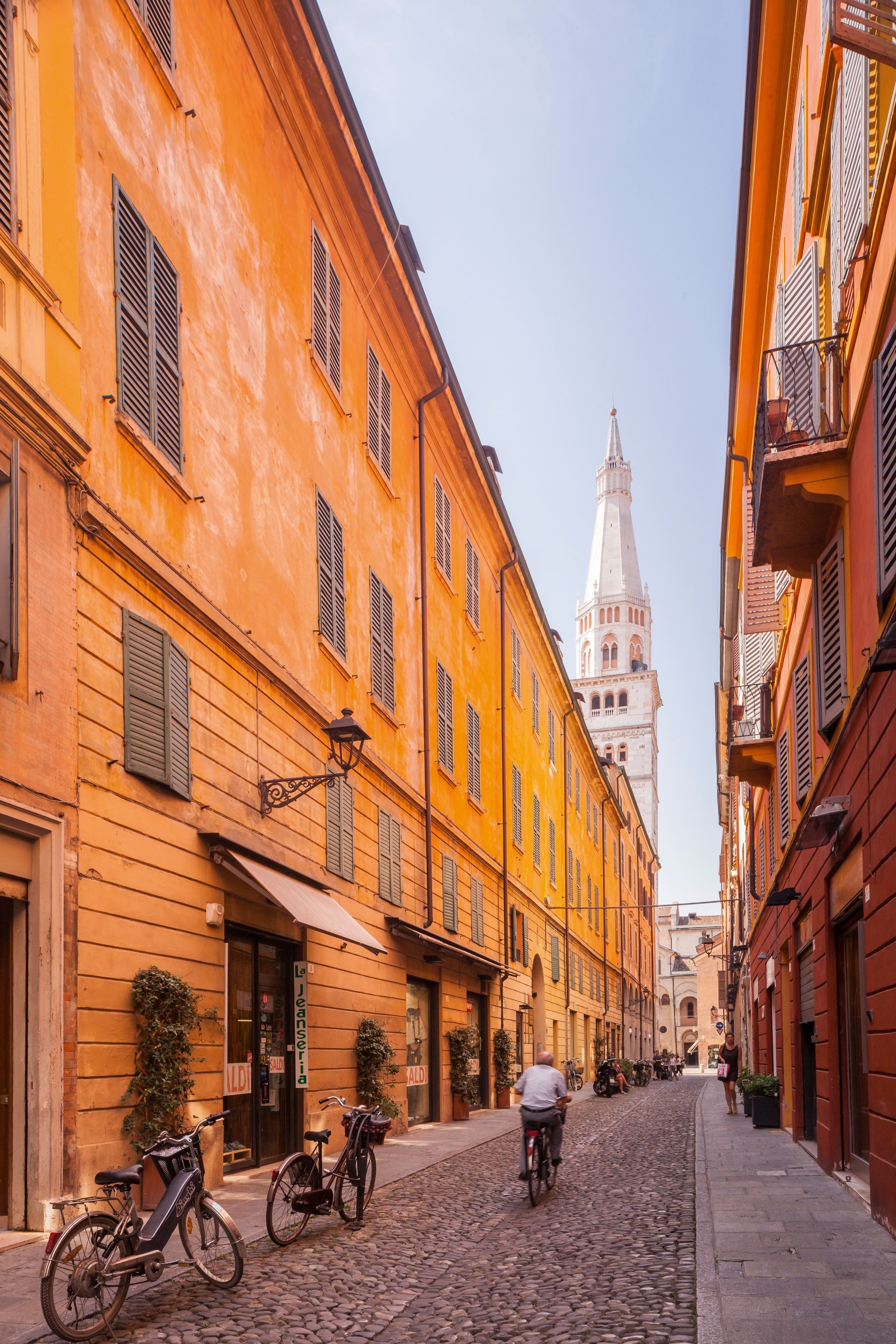 Via Cesare Battisti in Modena, Italy. The Torre Civico o Ghirlandina can be seen in the background