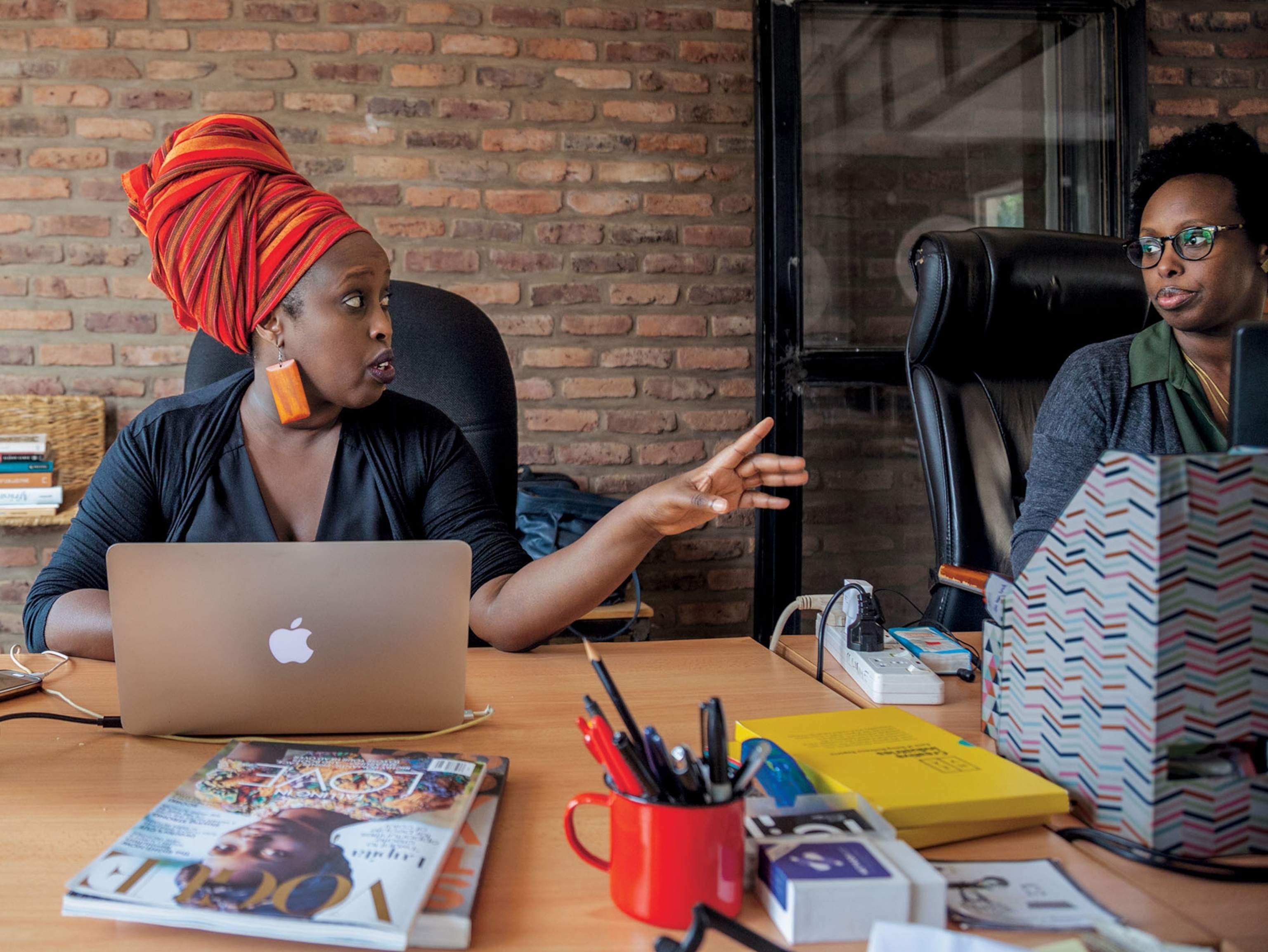 two women on their laptops side by side