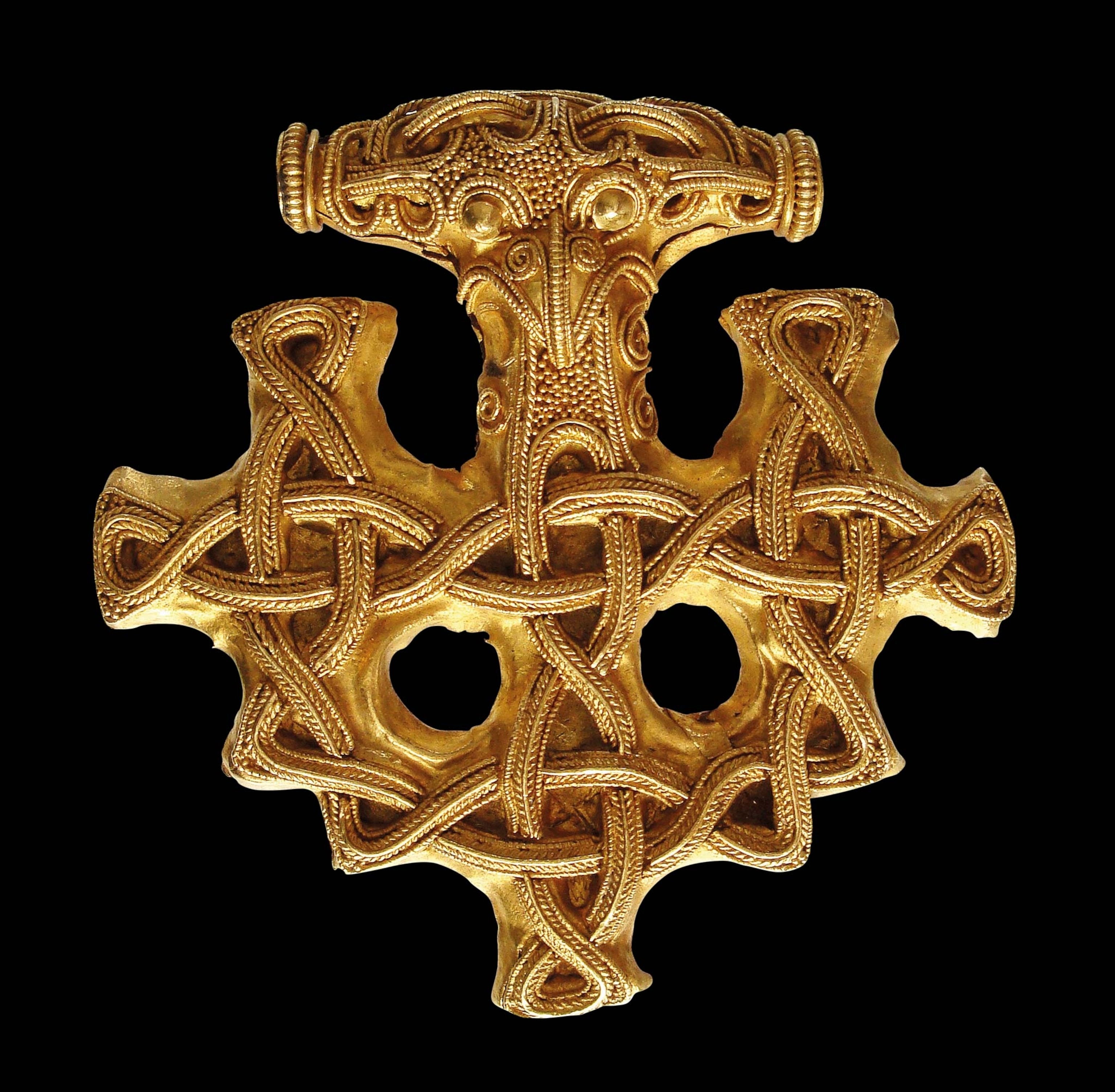 A bronze pendant shaped like a cross