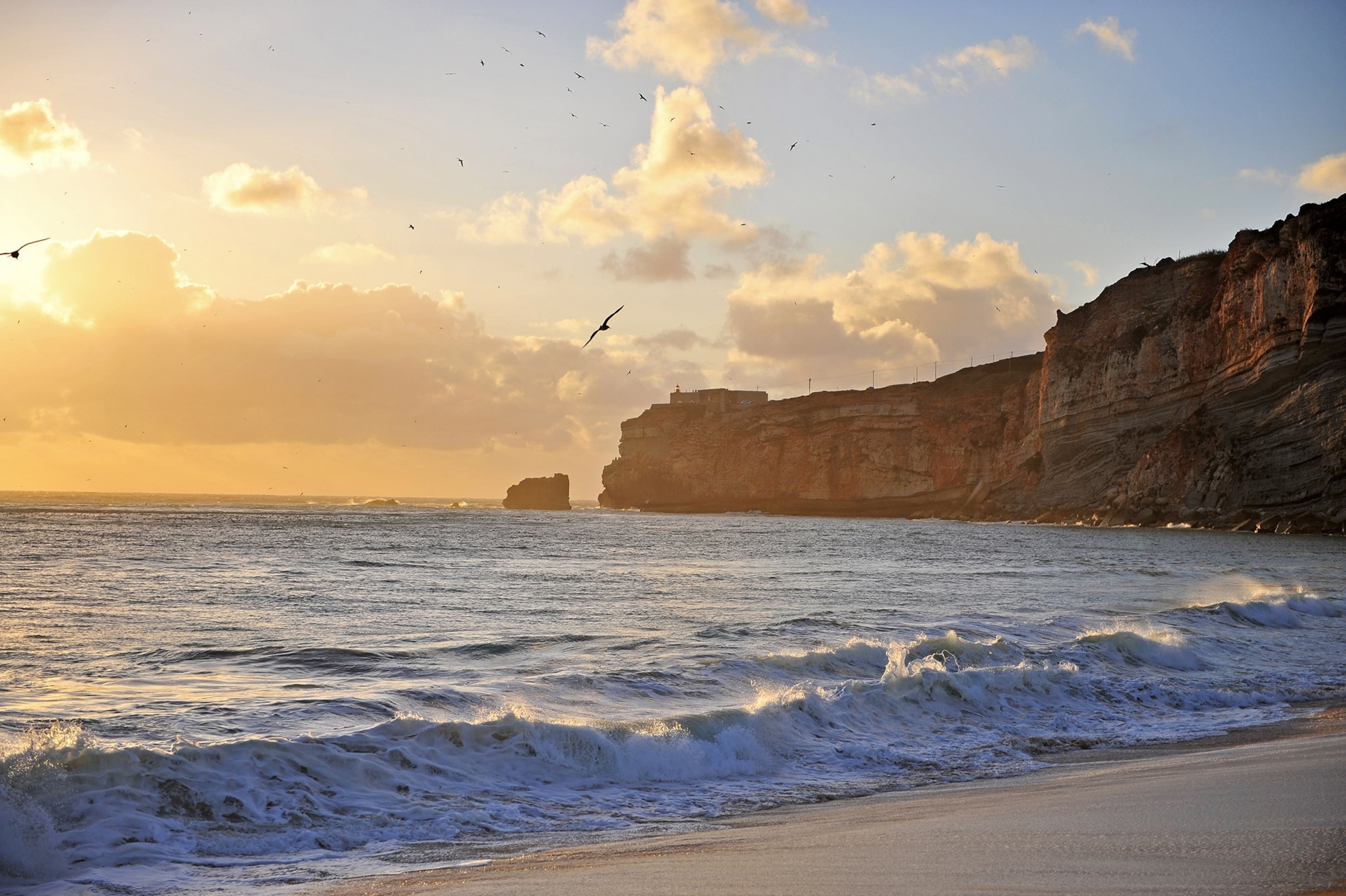 lighthouse in nazare surf town in portugal