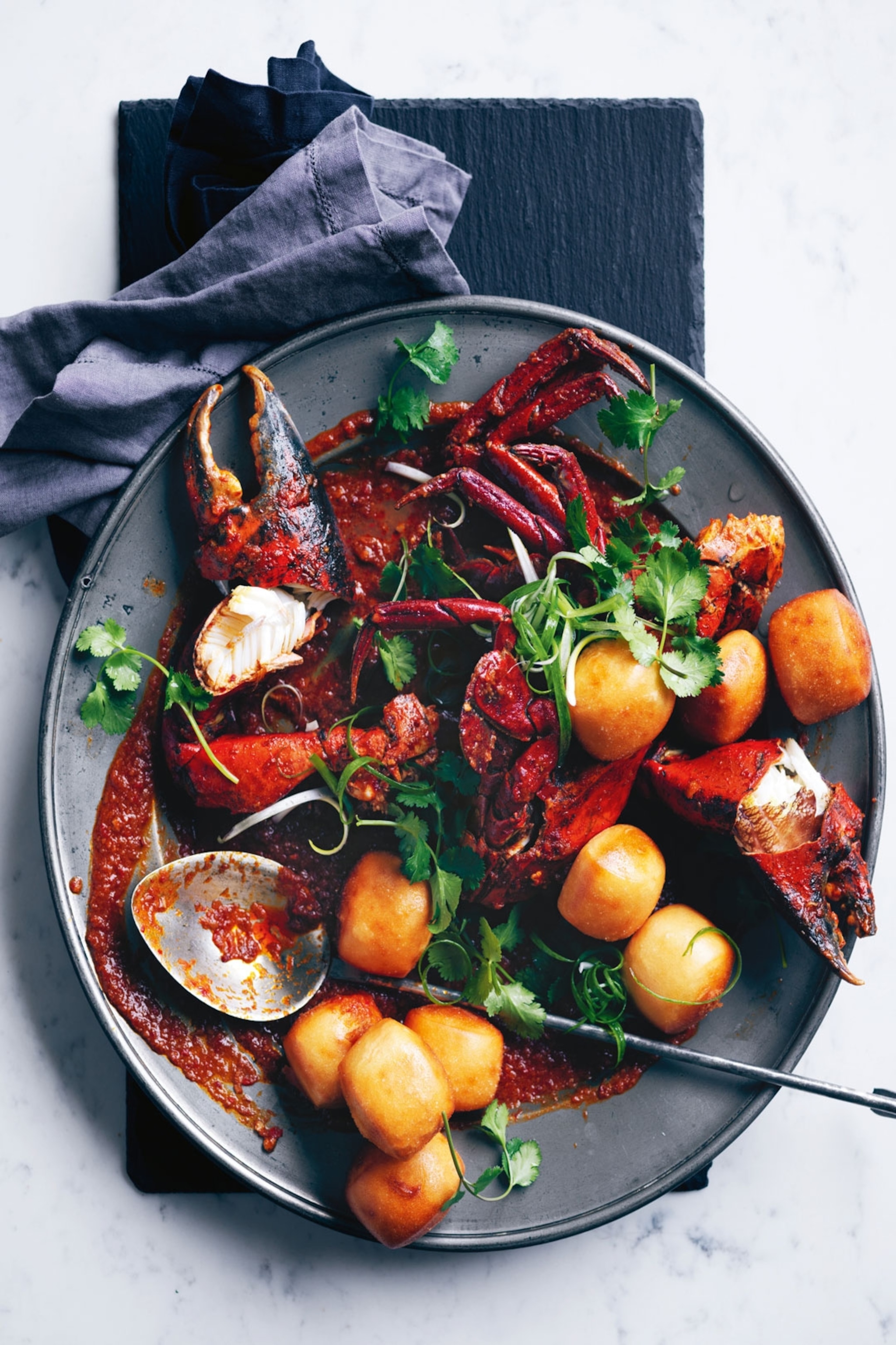 Plate with fish, chilli, potatoes and coriander