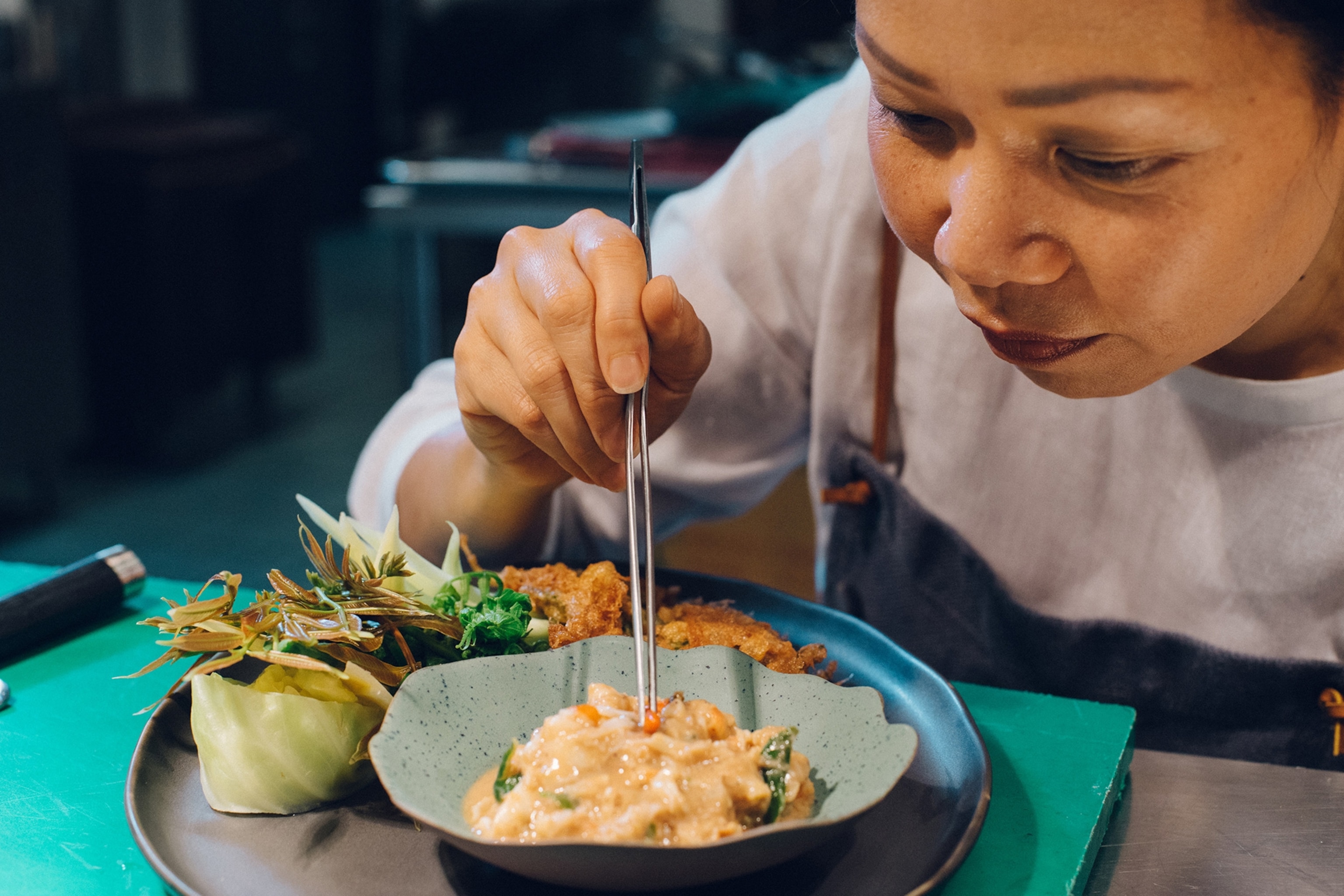 a chef preparing a meal in Bangkok, Thailand