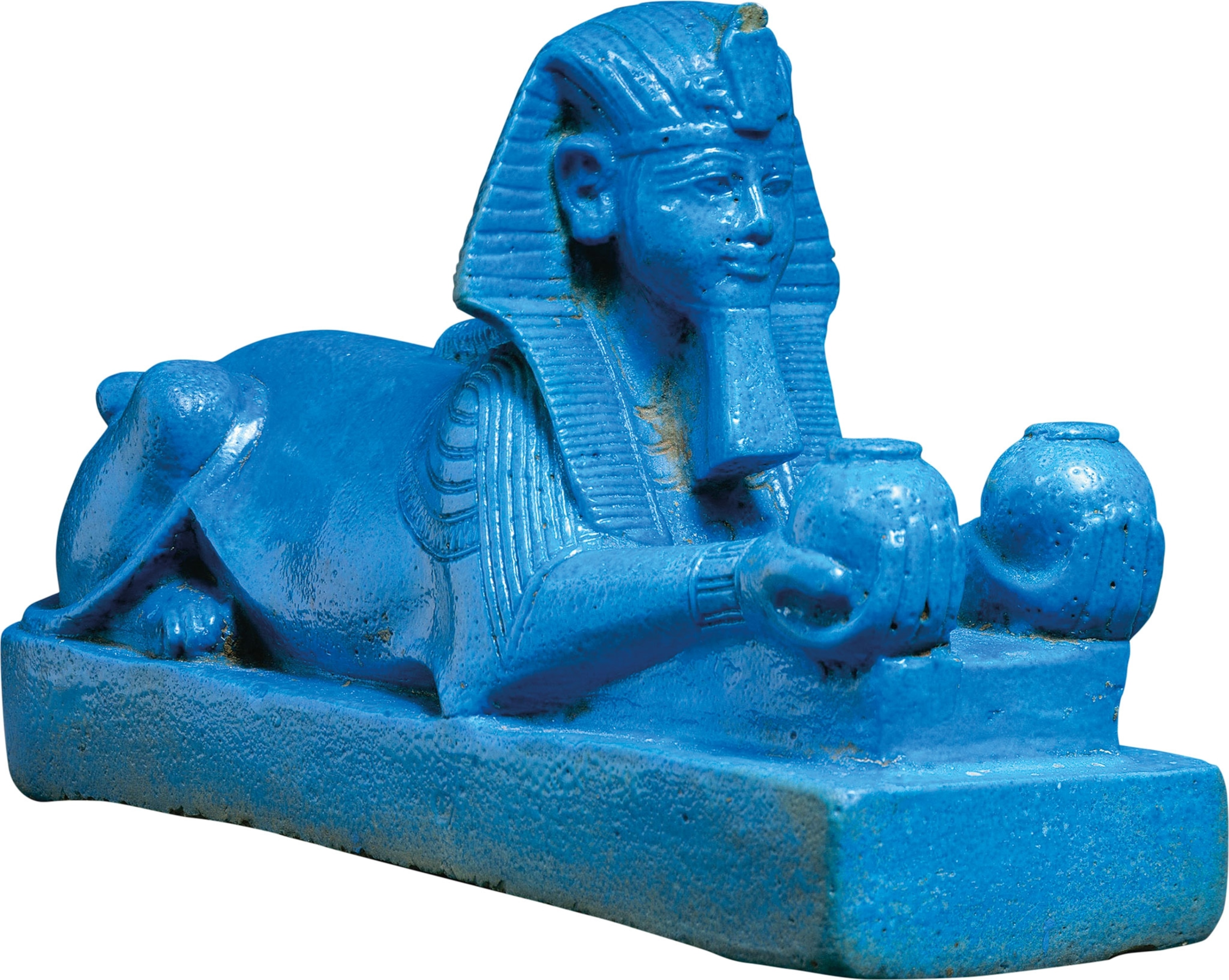 A blue figurine of a sphinx