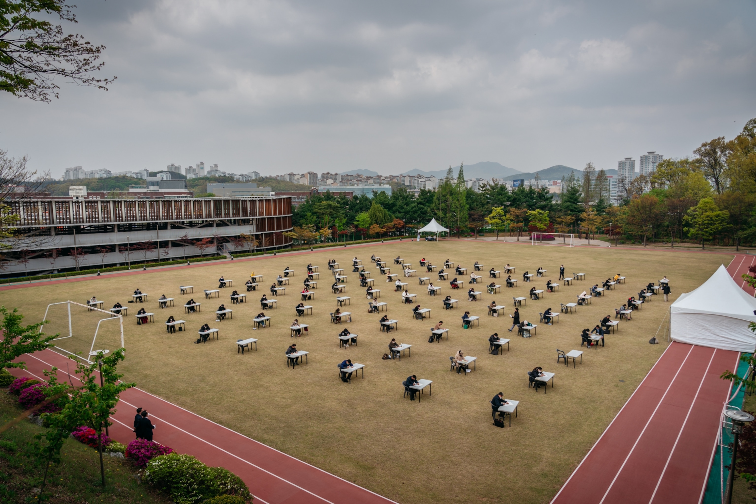 people take an exam outside in Korea