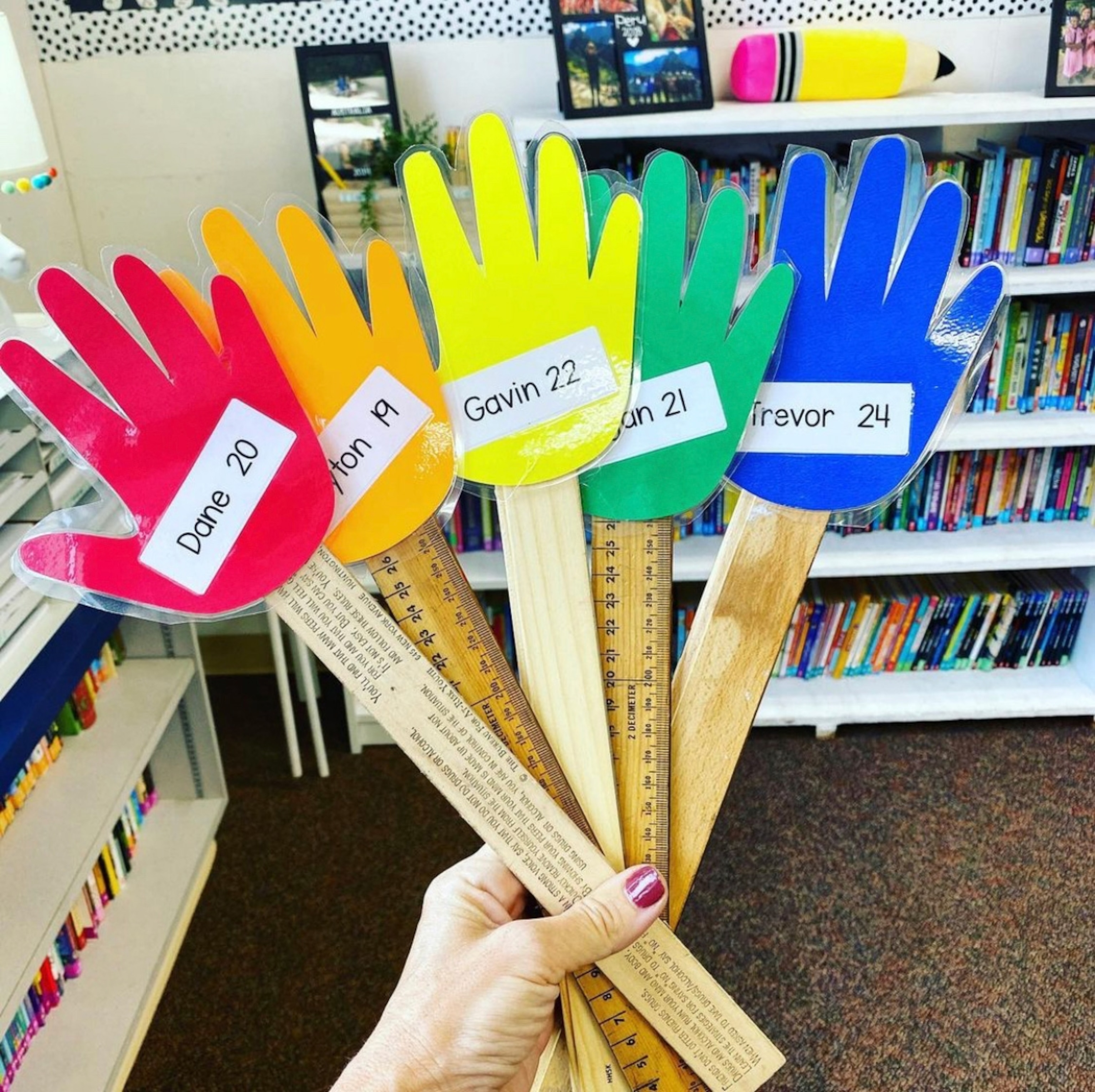 "Hand Raisers" made with rulers, which students use to raise their hands above the plexiglass barriers around their desks.