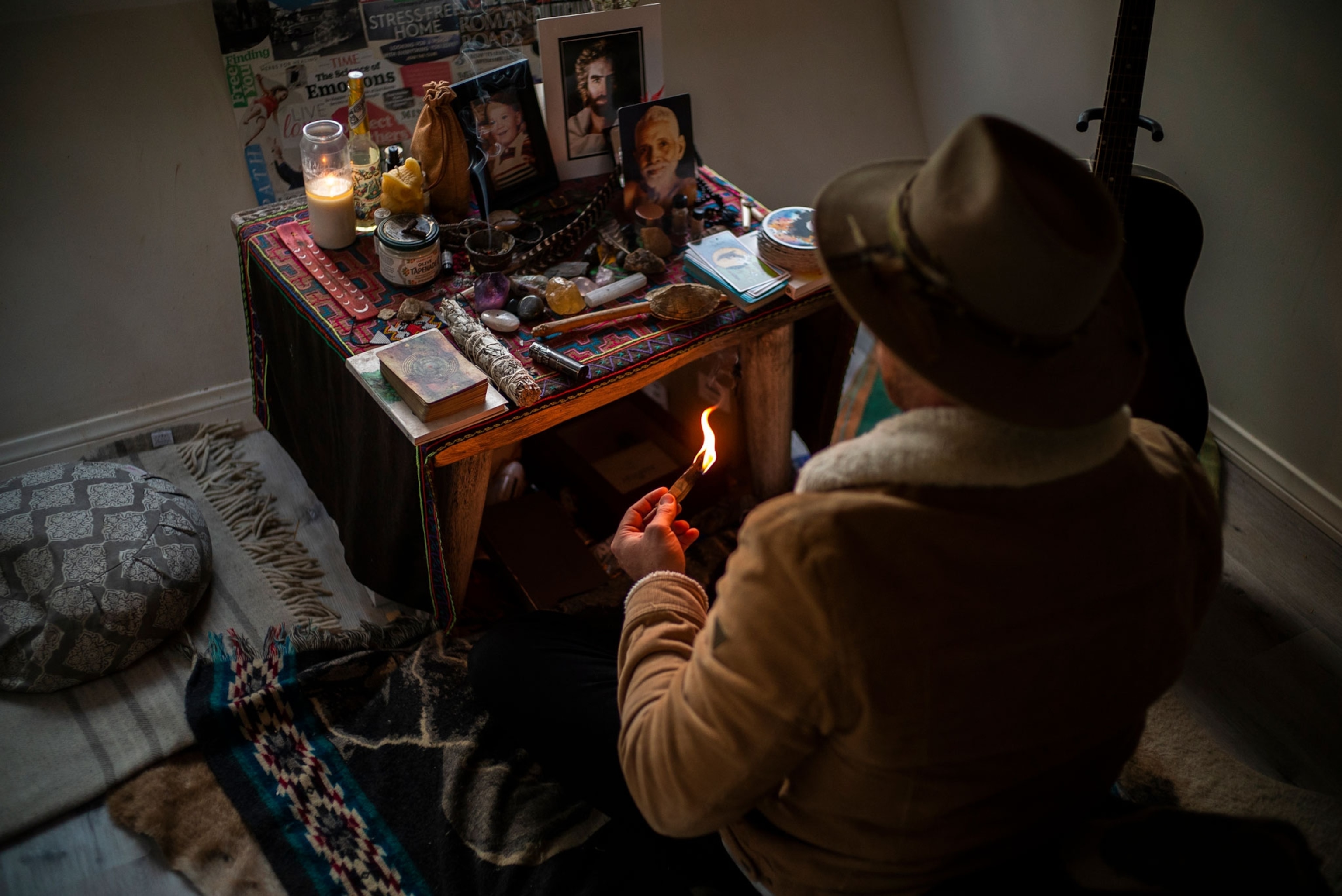 A man sits at his altar following a microdose