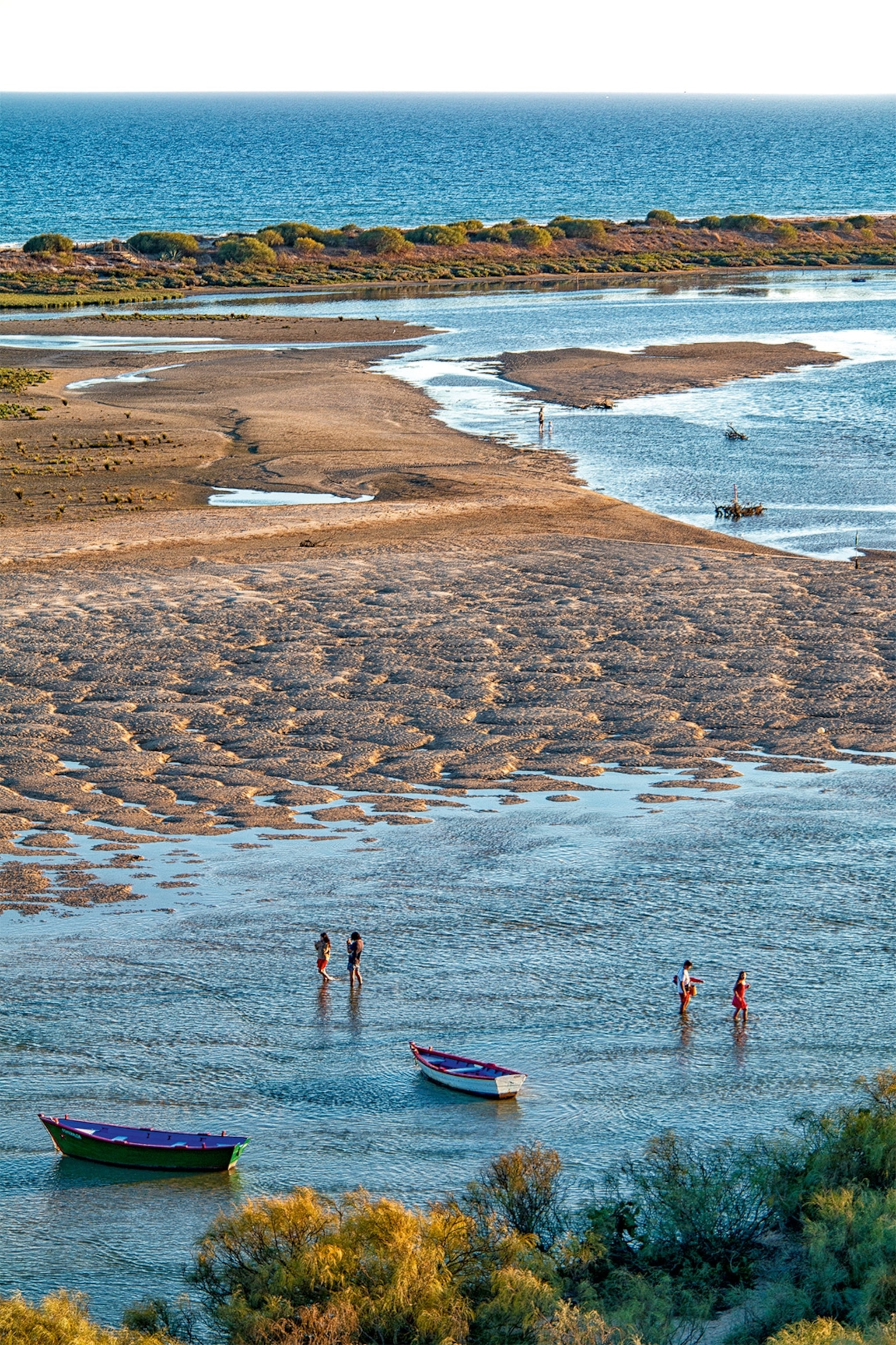 Fishing boats on the beach in Ria Formosa.