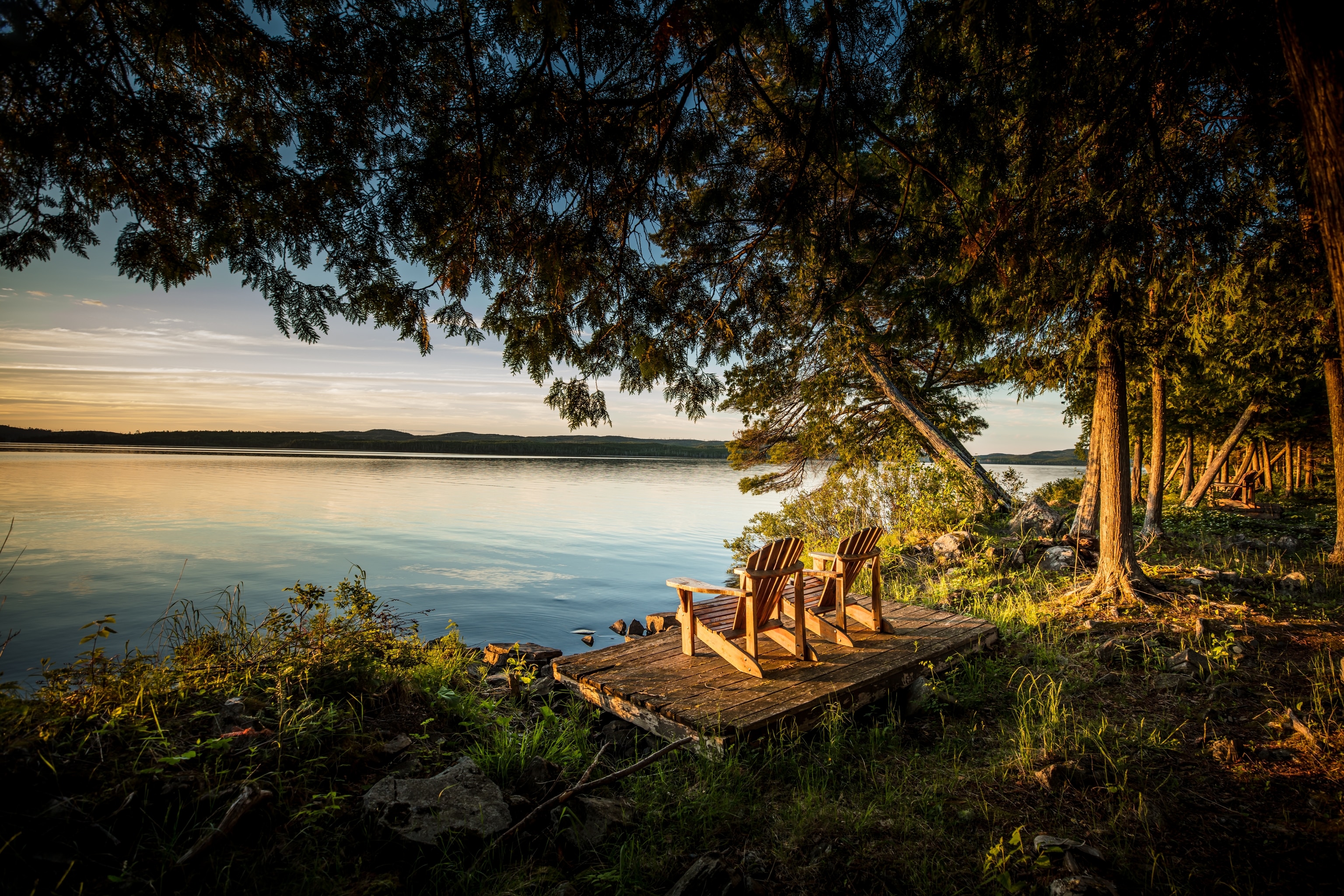 Chairs by lake