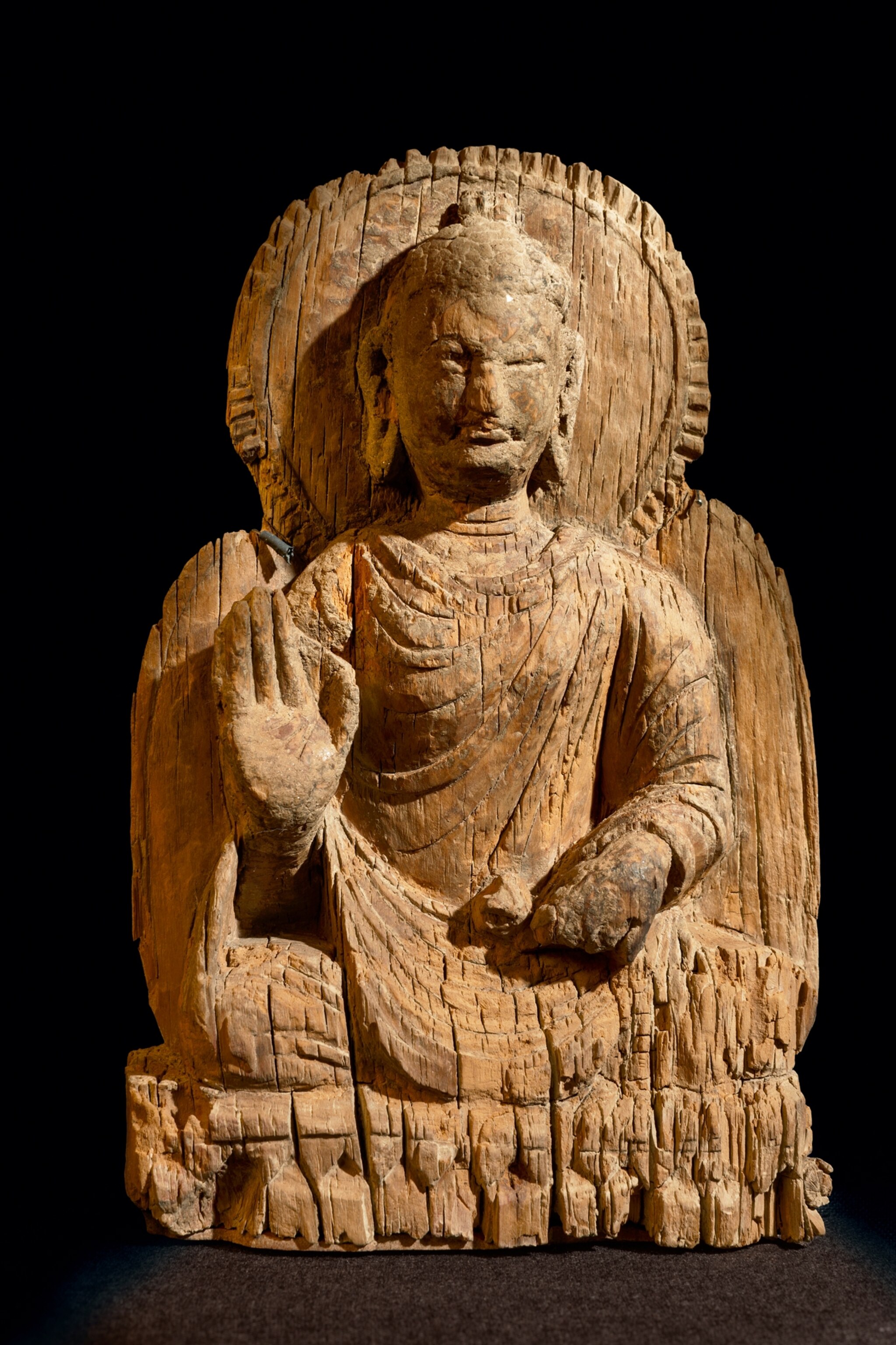 Picture of wooden Buddha stature.