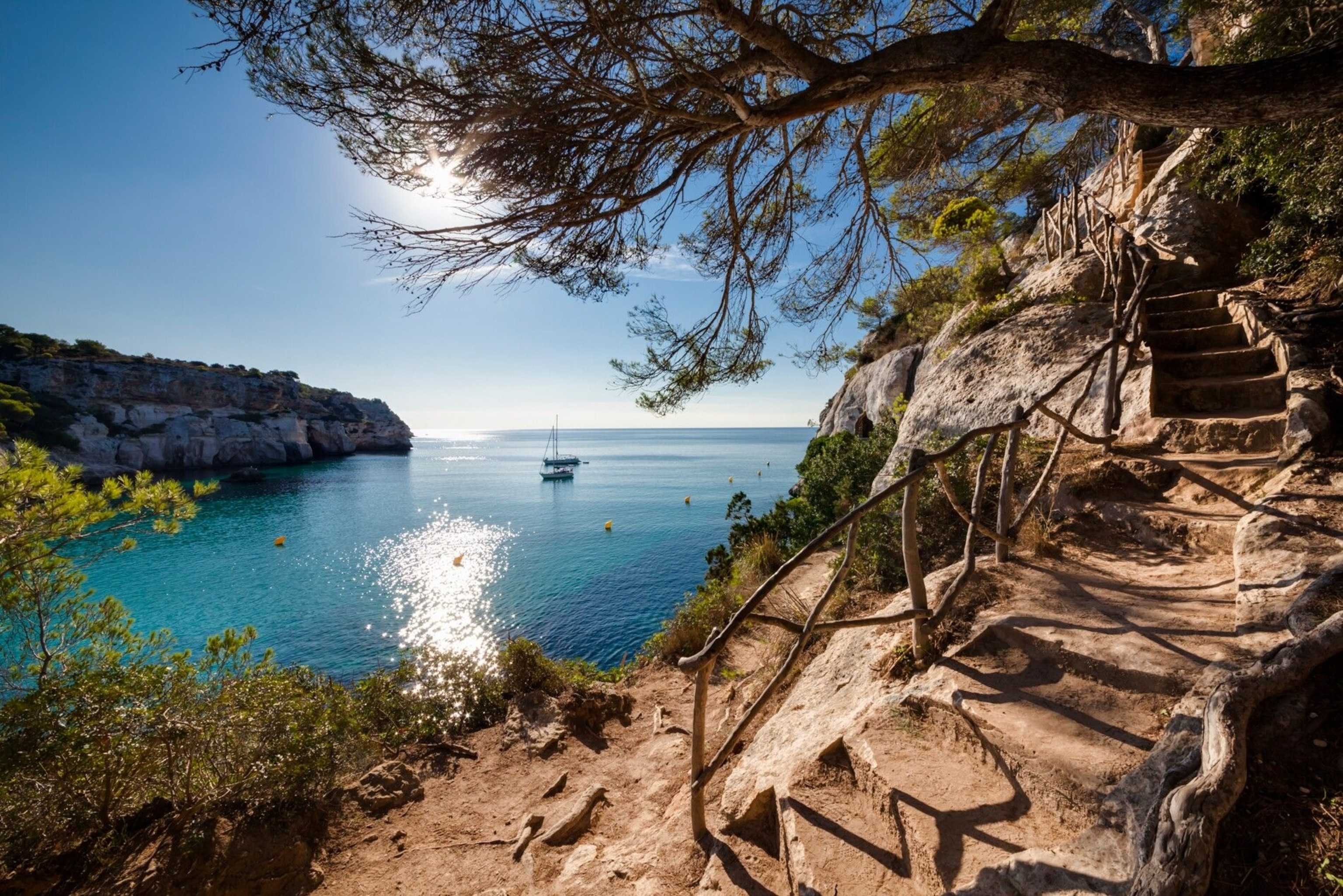 Steps on a hiking route, with view to the sea