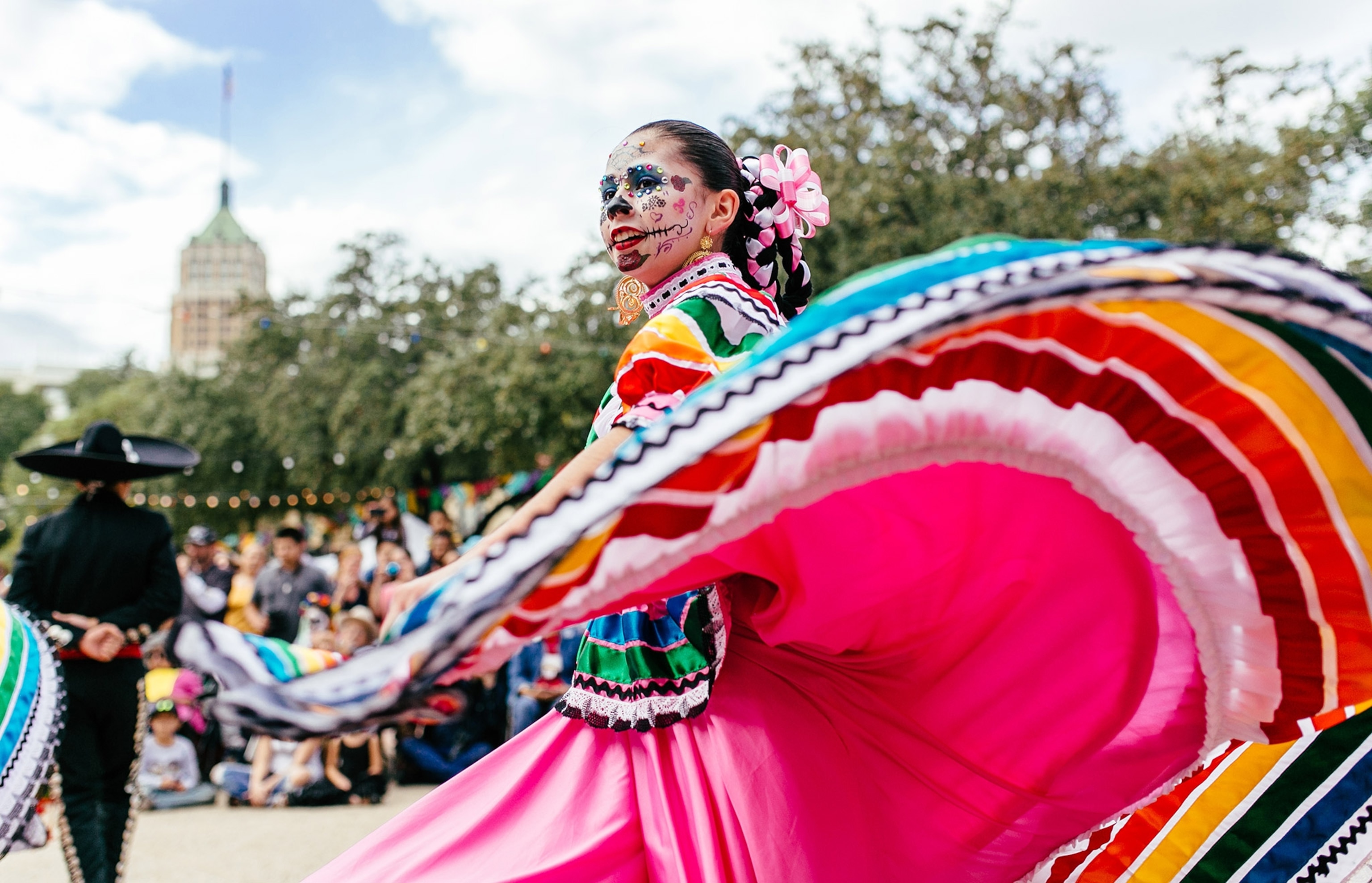 people dancing during the Dia de Los Muertos festival in San Antonio, Texas