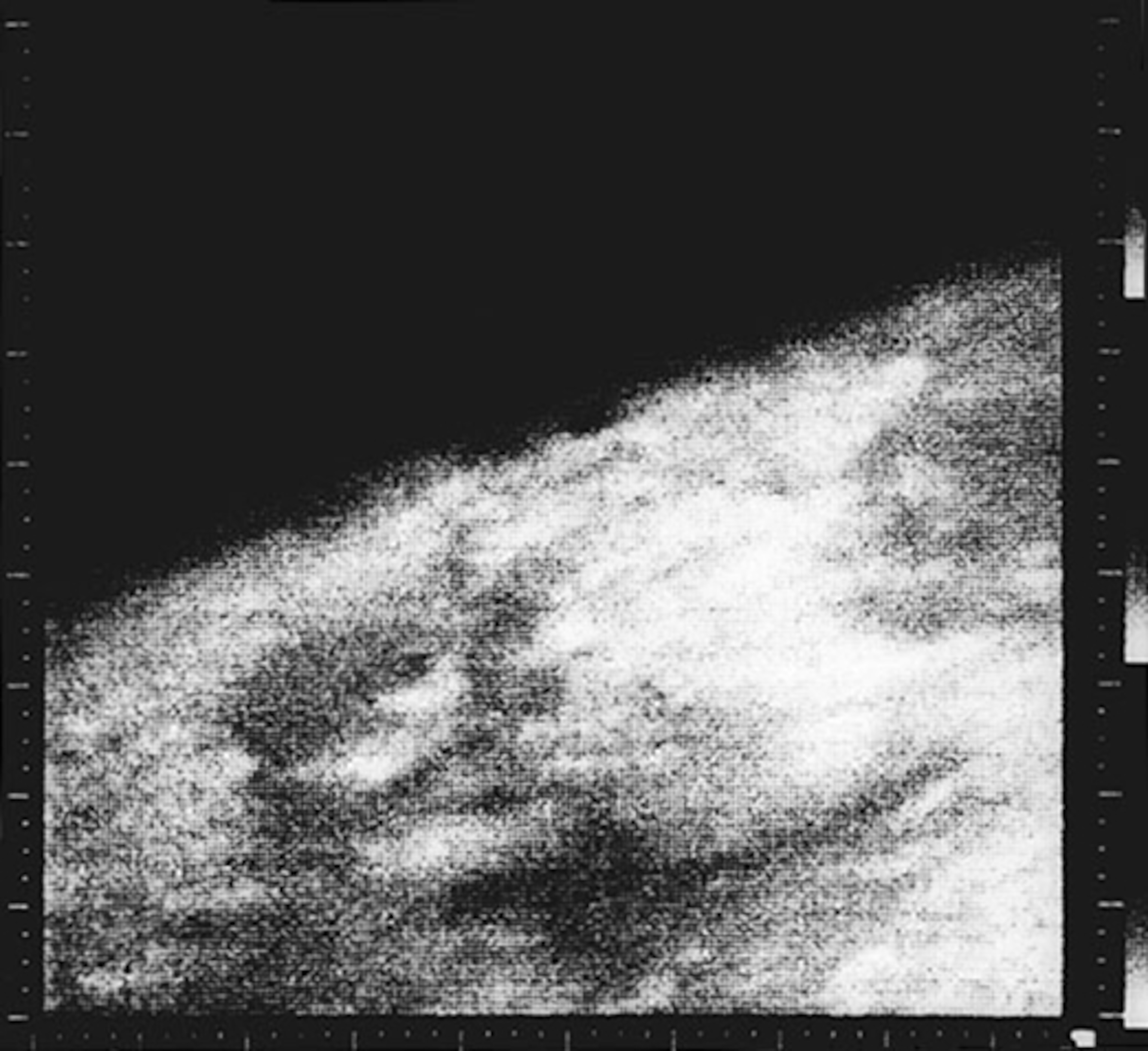 b&W blurry photo of planet surface.