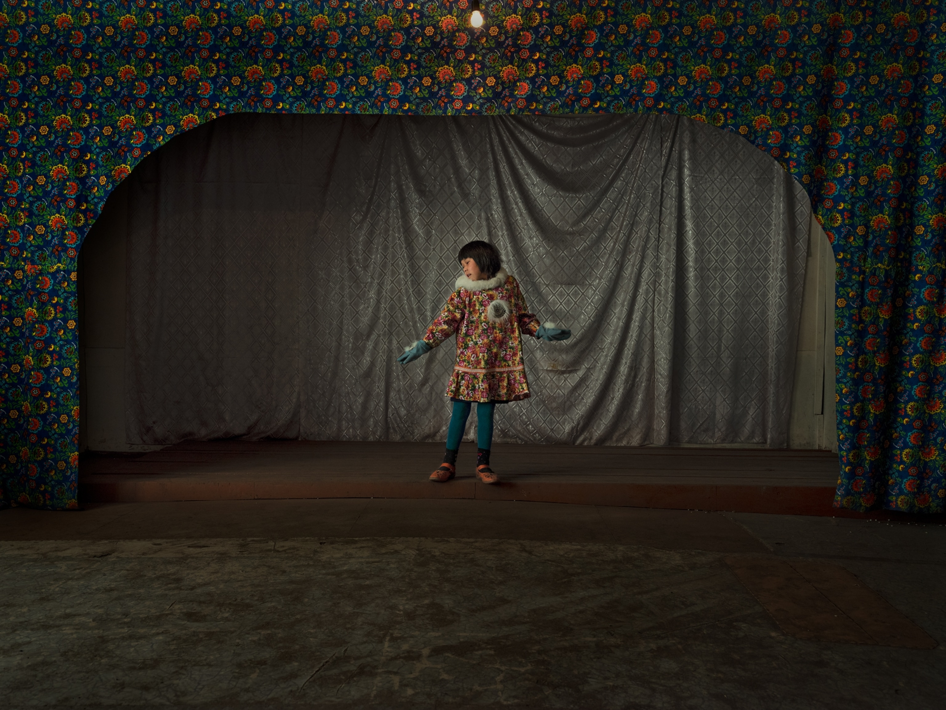 girl in traditional dress onstage.