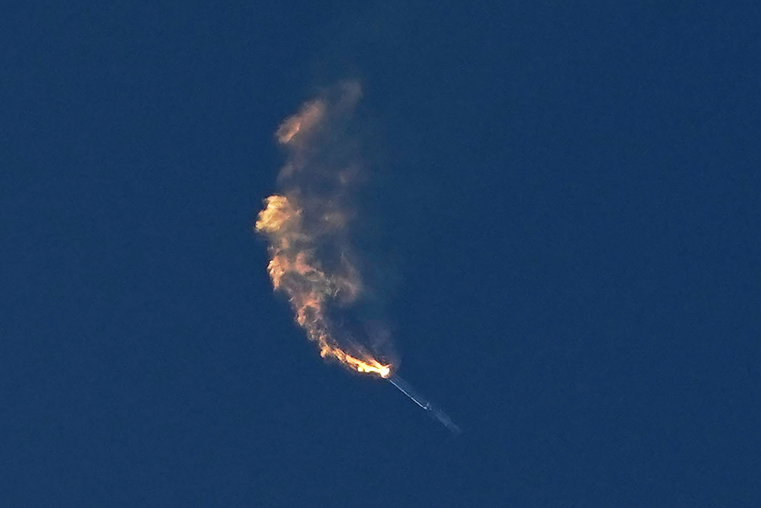 SpaceX's Starship is seen while it flipped four times during a failure to separate.