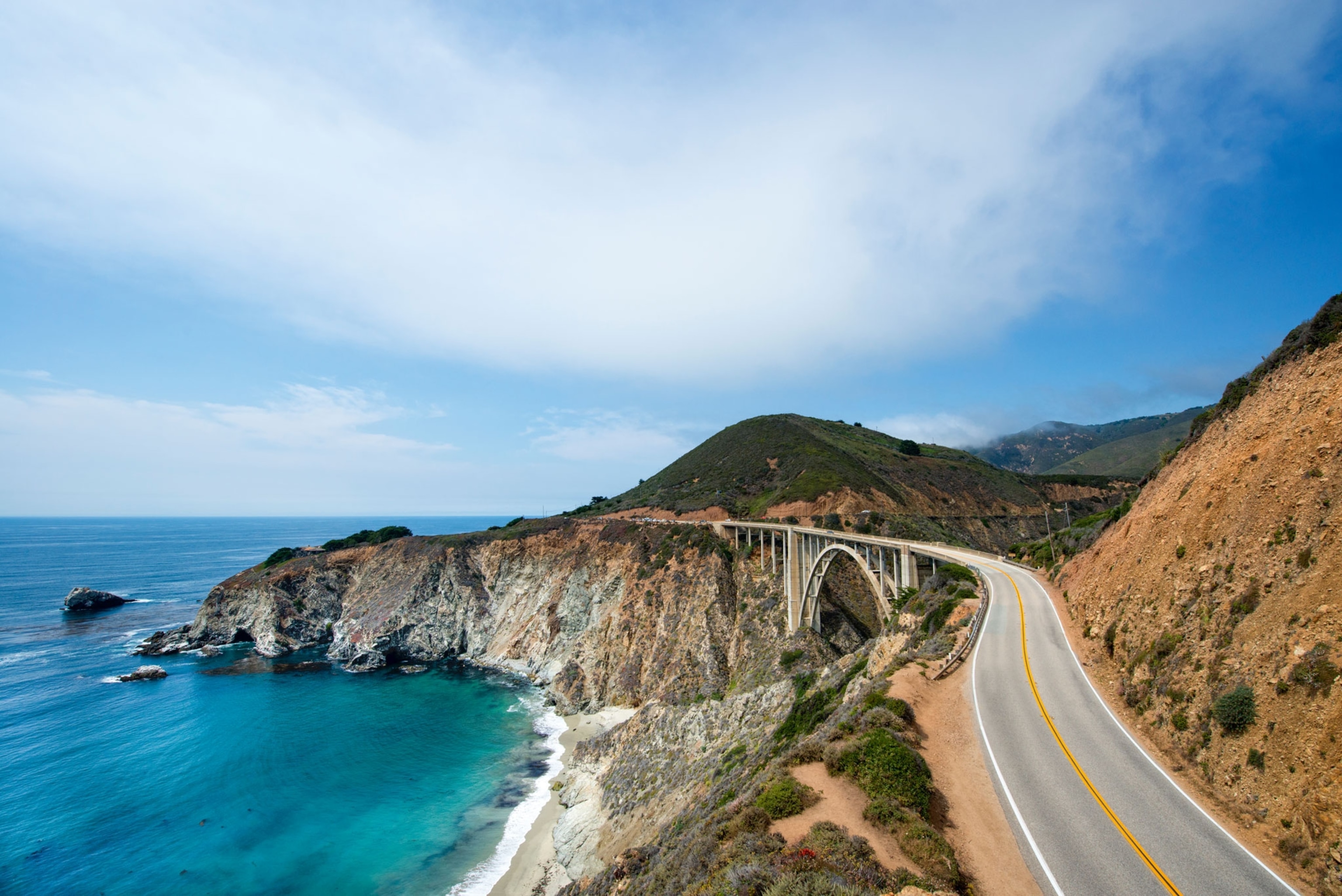 Winding Highway 1 along the sheer cliffs of California Coastline near Big Sur.