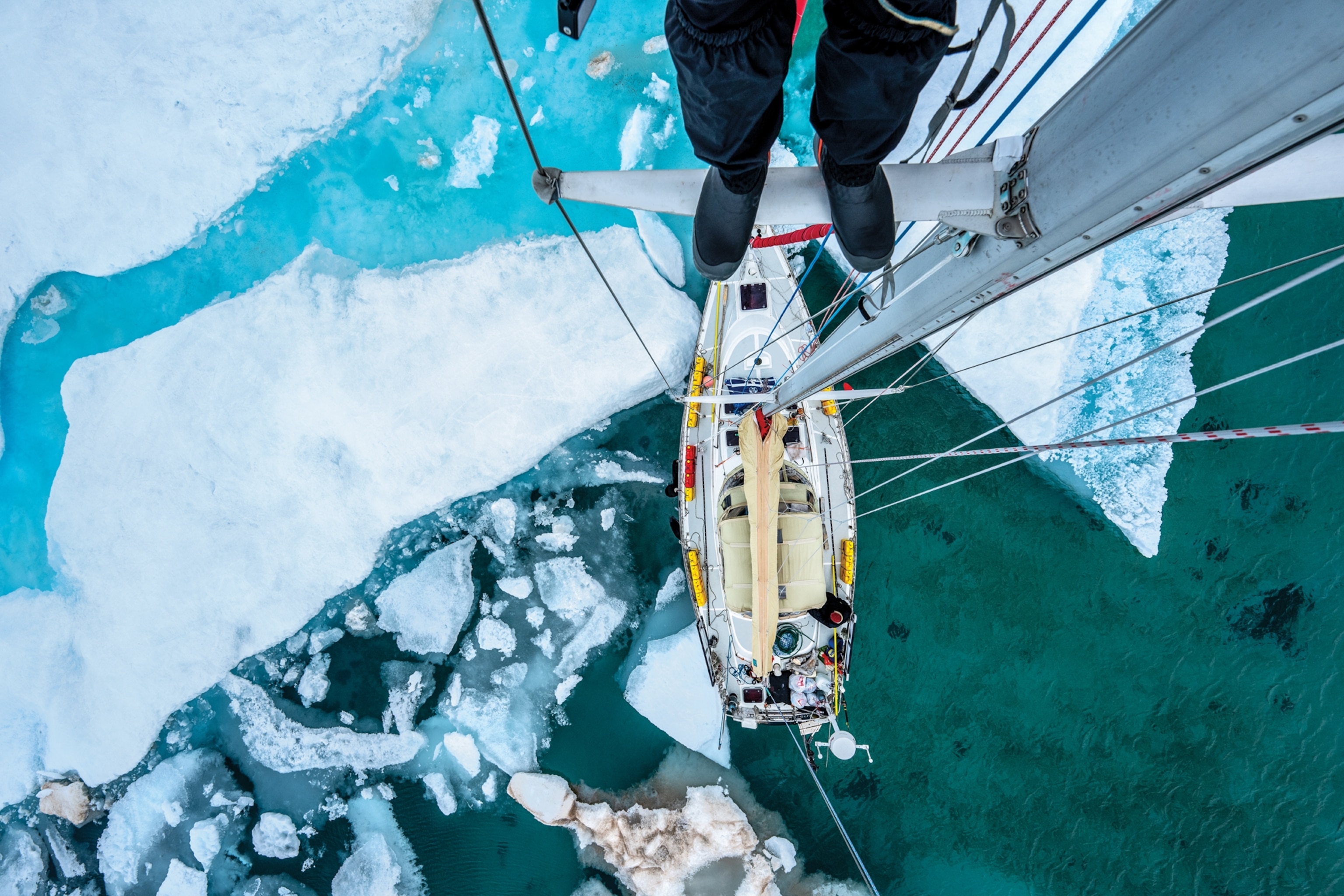 View down on ship deck from mast top.