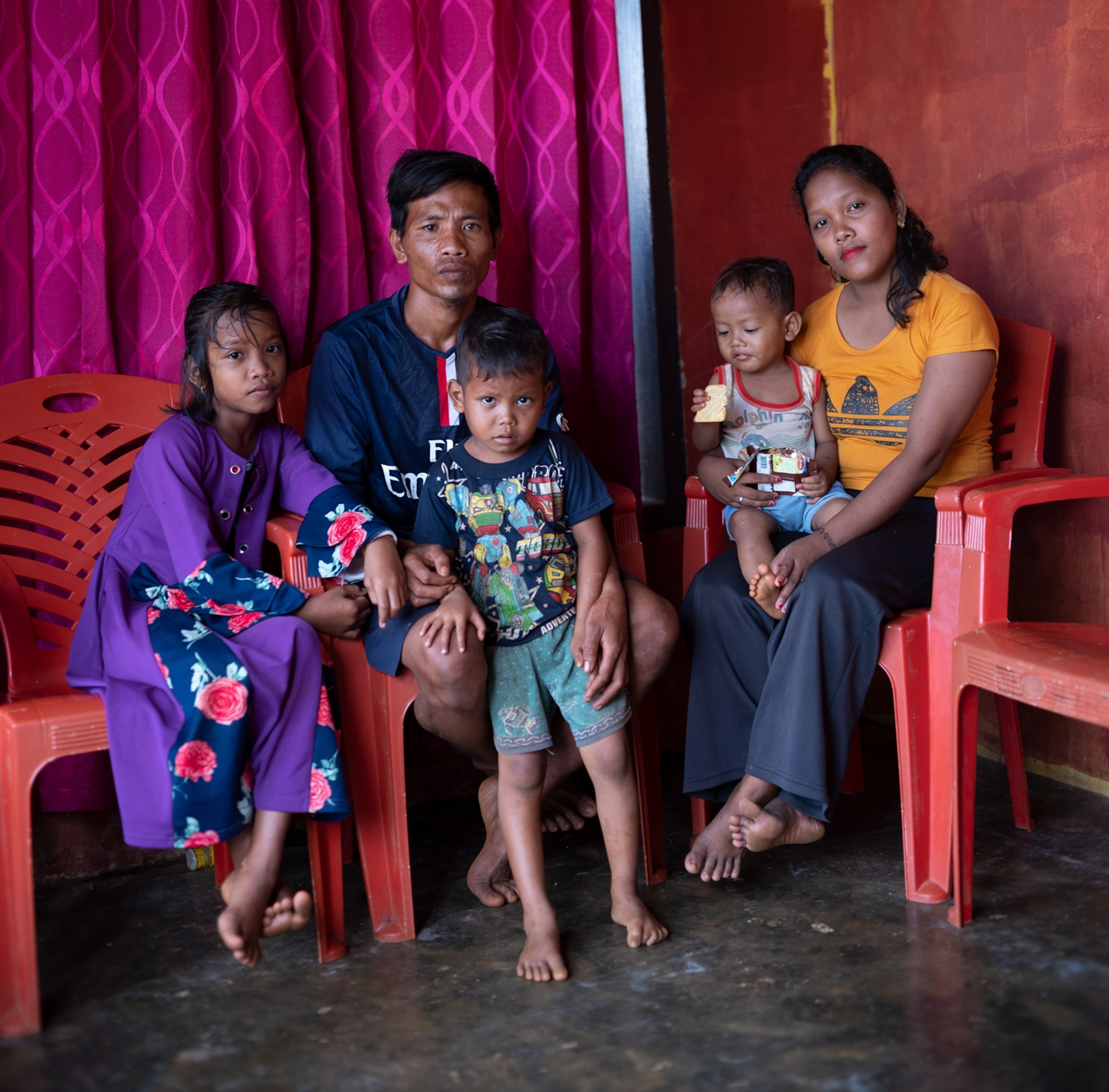 Picture of family with three children.
