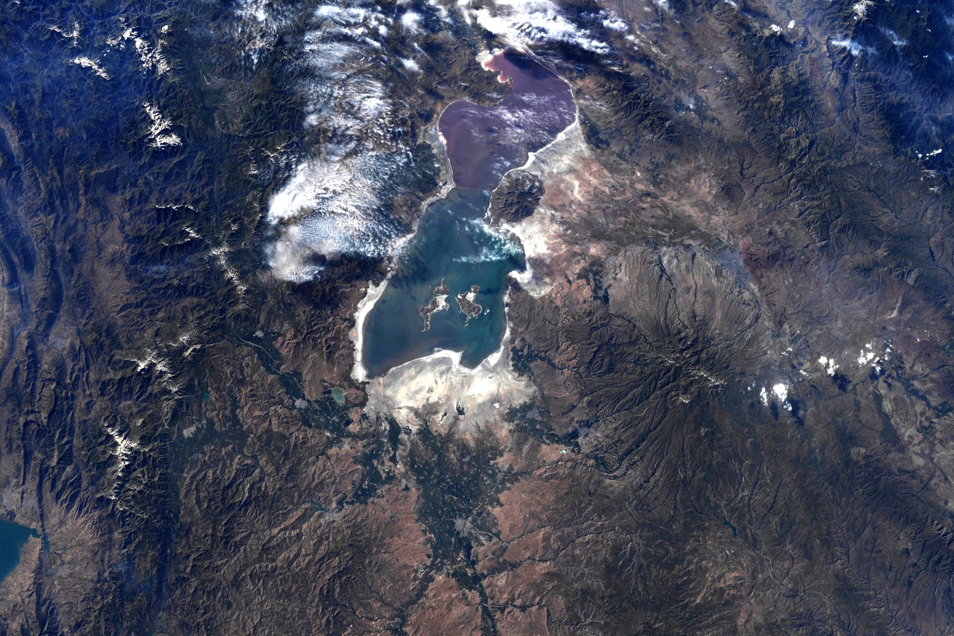blue lake on brown earth.