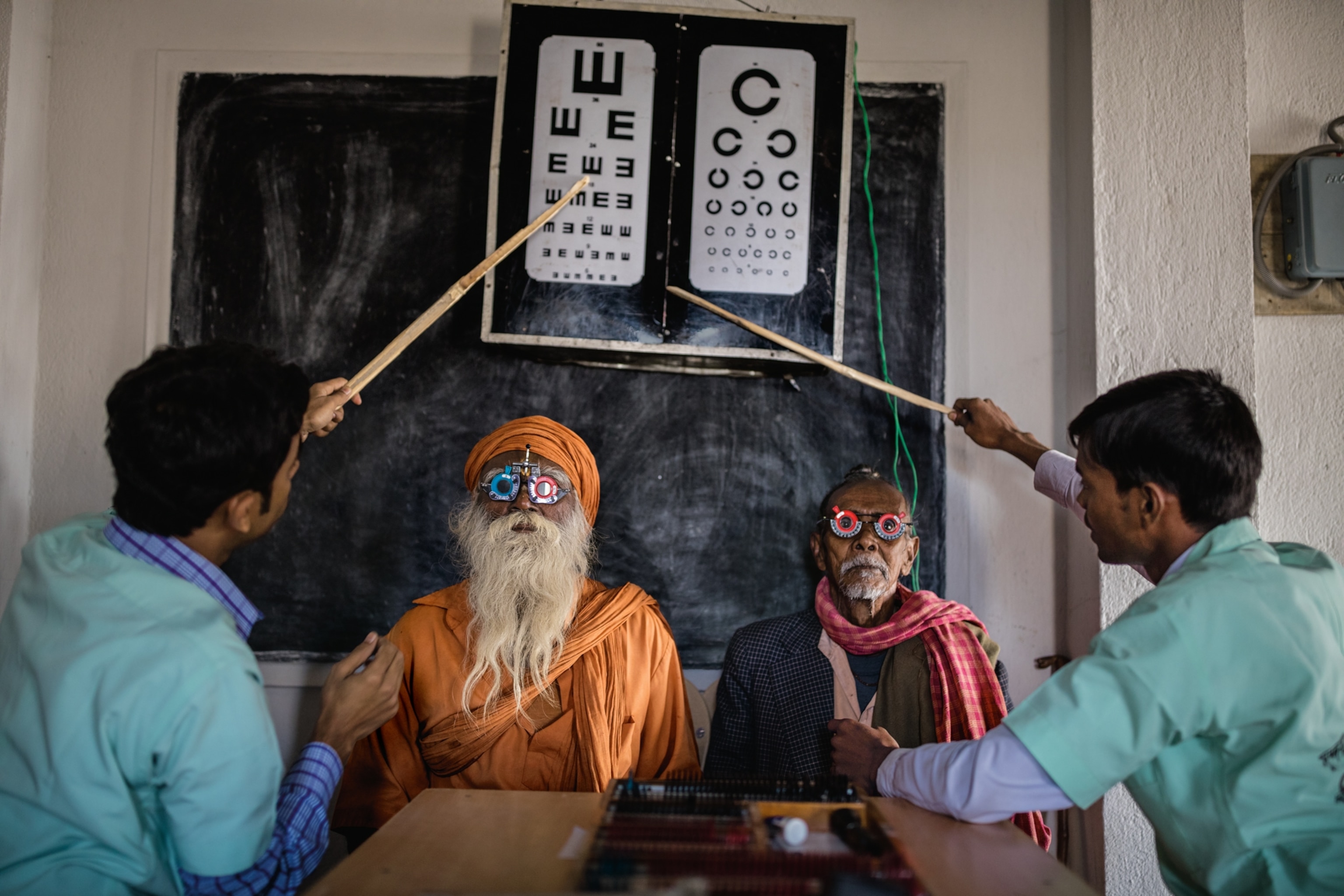 residents of India's Sundarbans region donning test-lens frames for eye exams