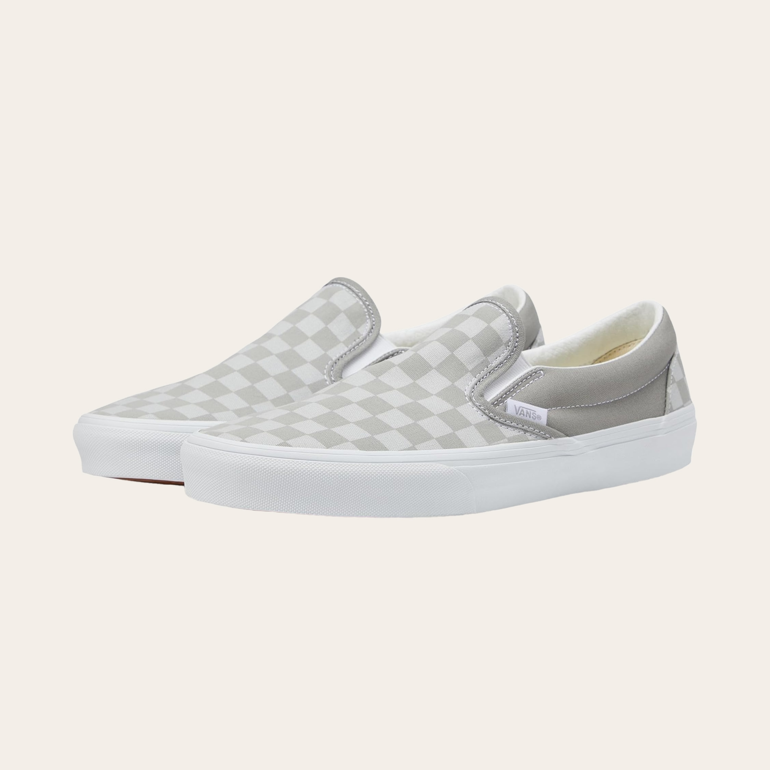 An image of white slip-on sneakers.