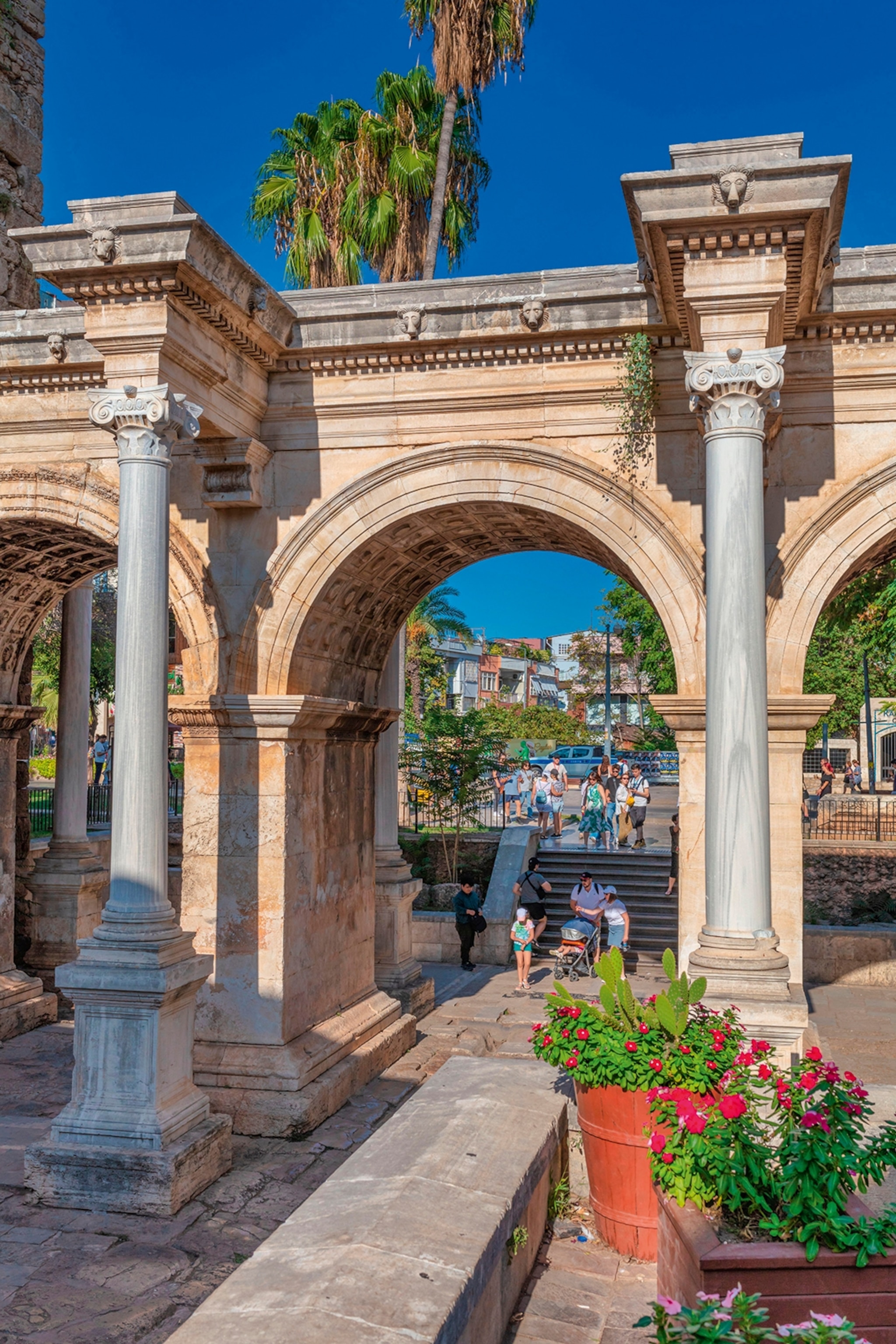 Ancien archway with people walking through it