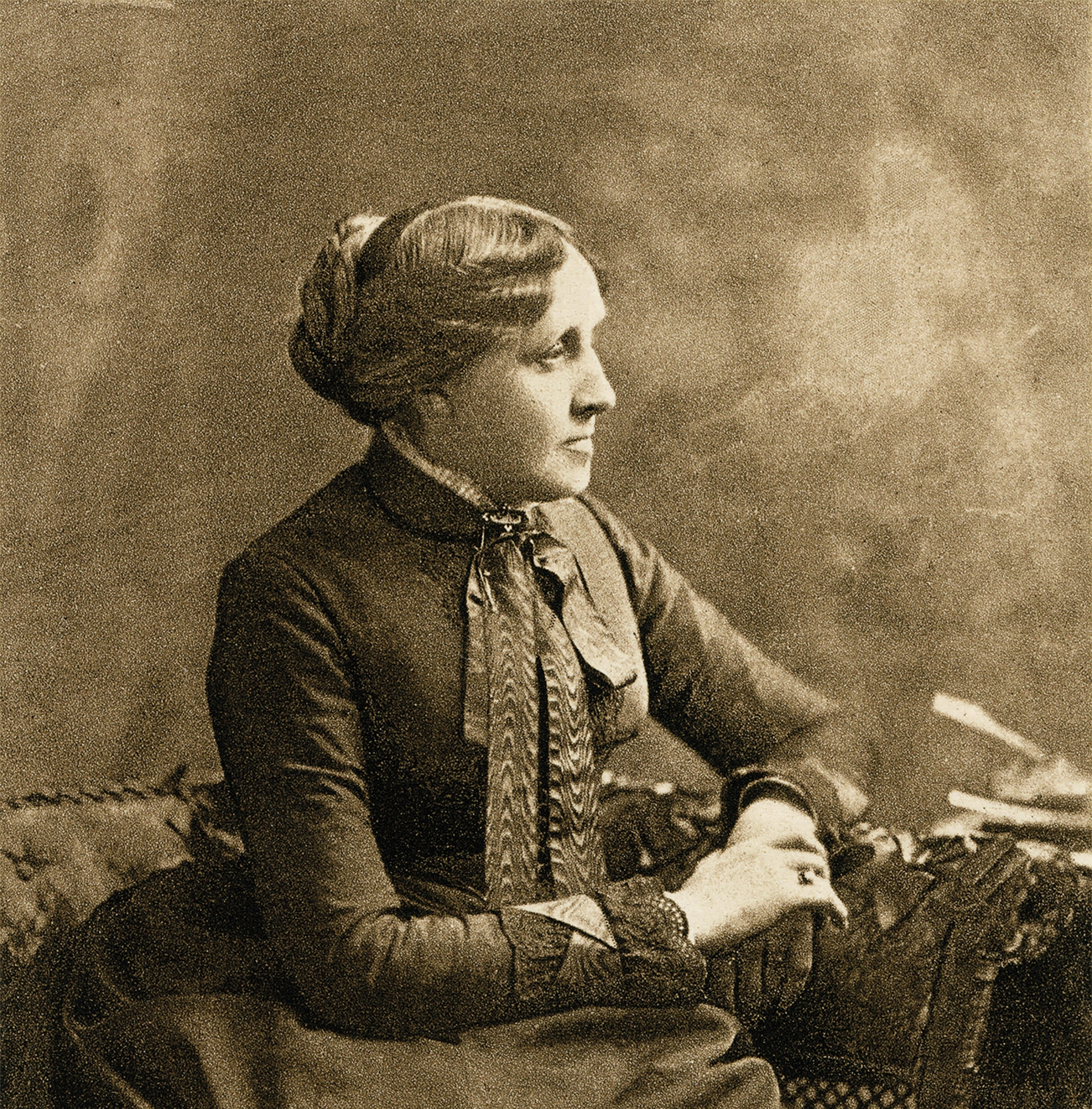 Novelist Louisa May Alcott sits in a photograph taken in the 1880s.