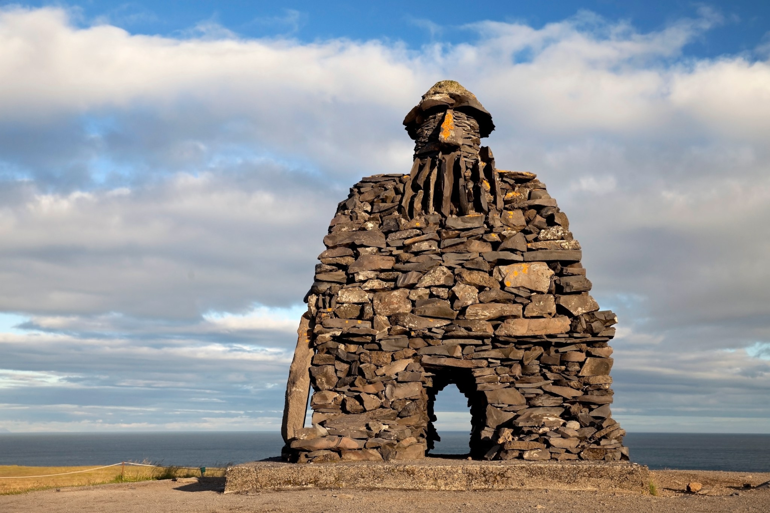 A large rock statue in the form of a troll