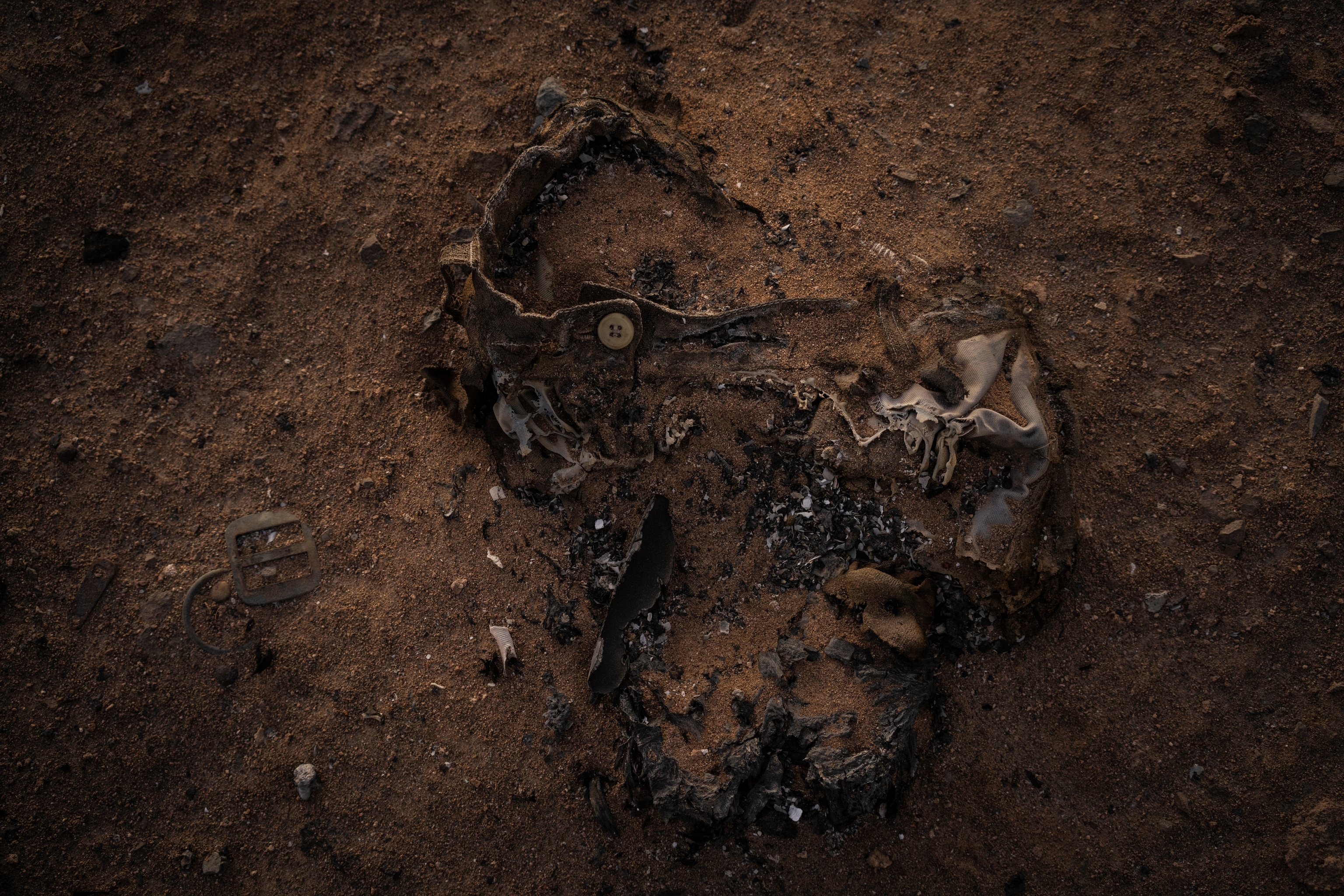 pants burned into the dirt ground