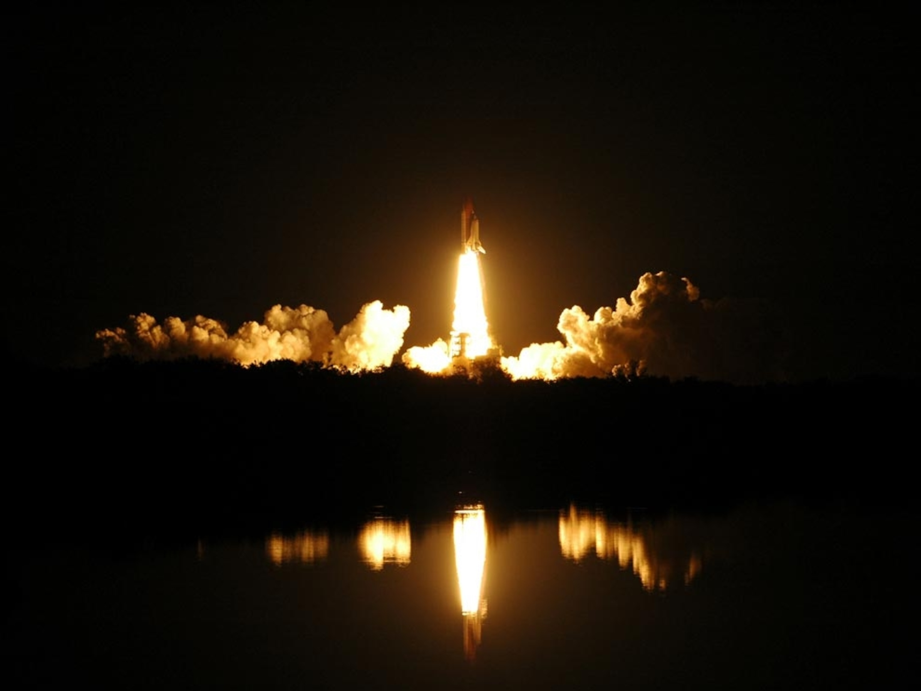 space shuttle Endeavour launching at night