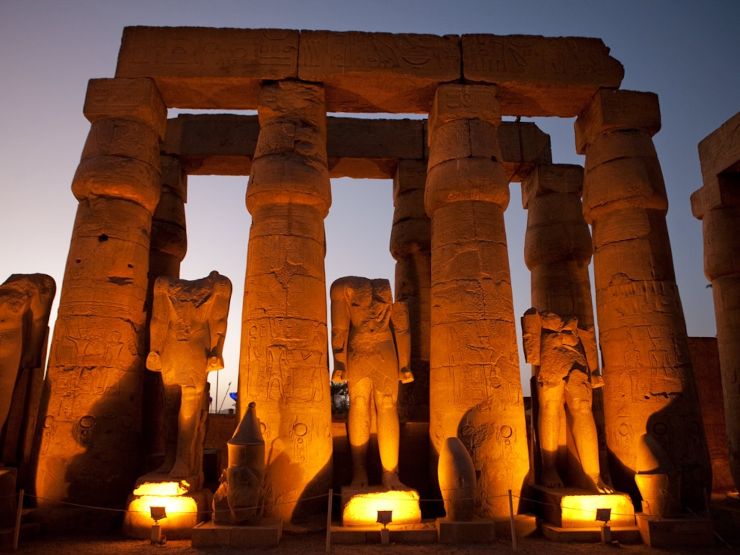 Illuminated statues and temple ruins