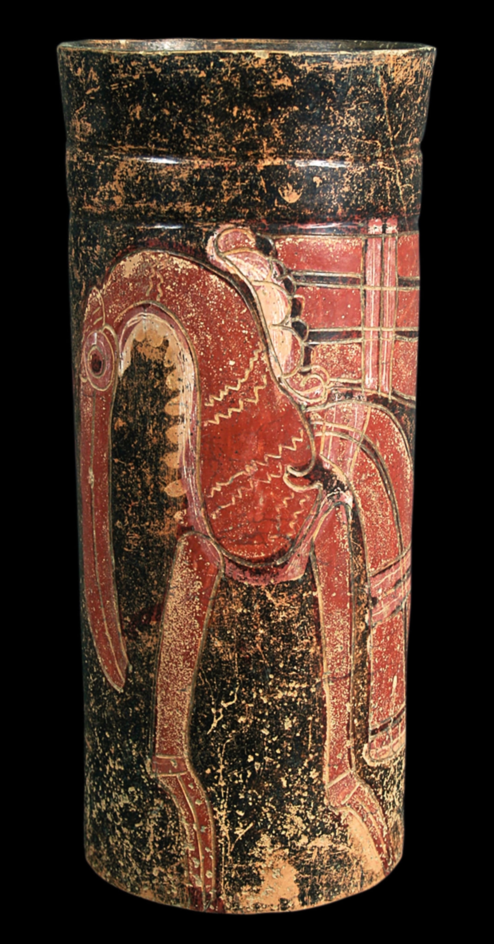 A black vase with a red bird like animal illustrated on it
