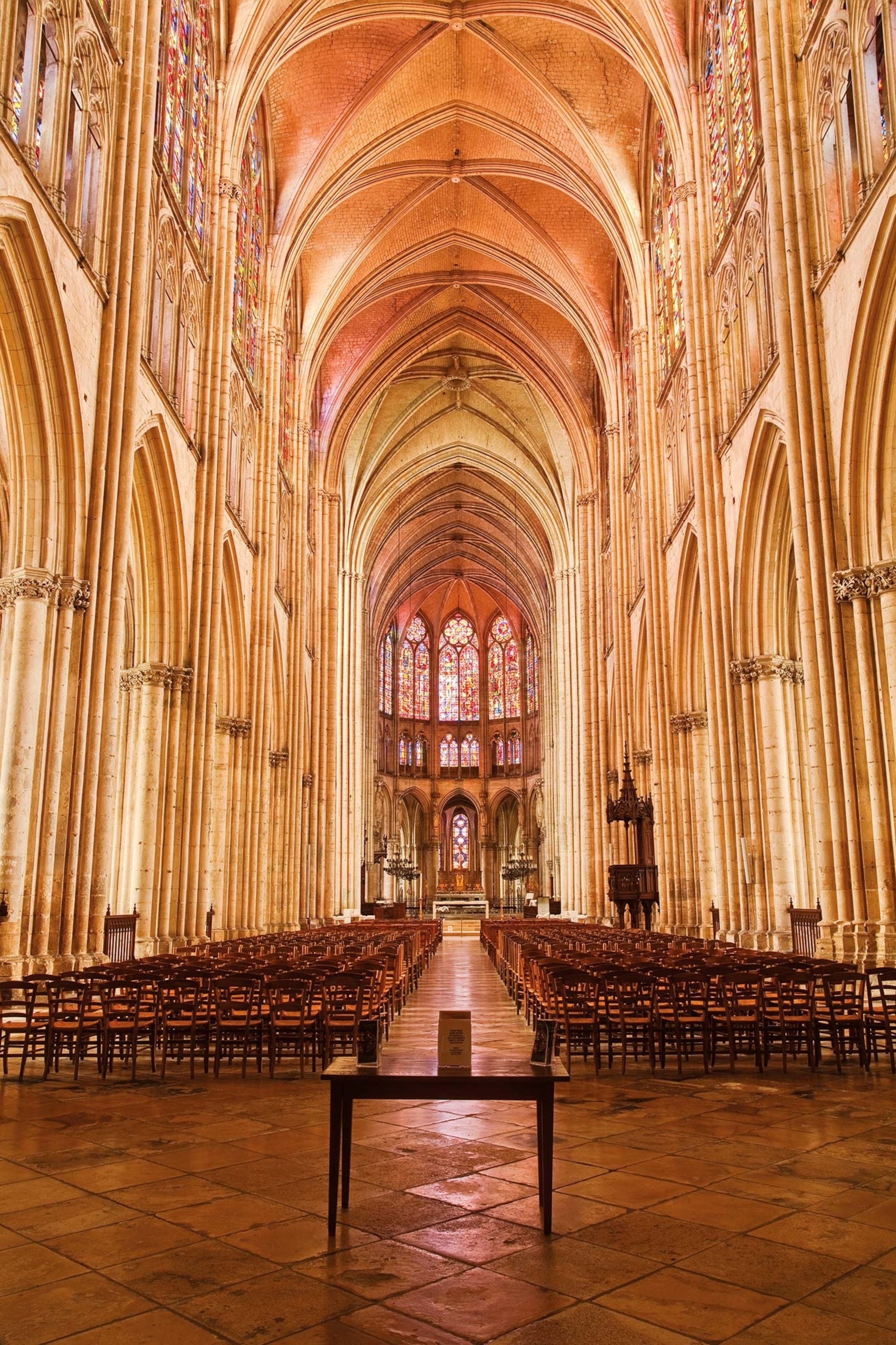 A view of the altar and pews in the Cathédrale Saint-Pierre-et-Saint-Paul in Troyes, France