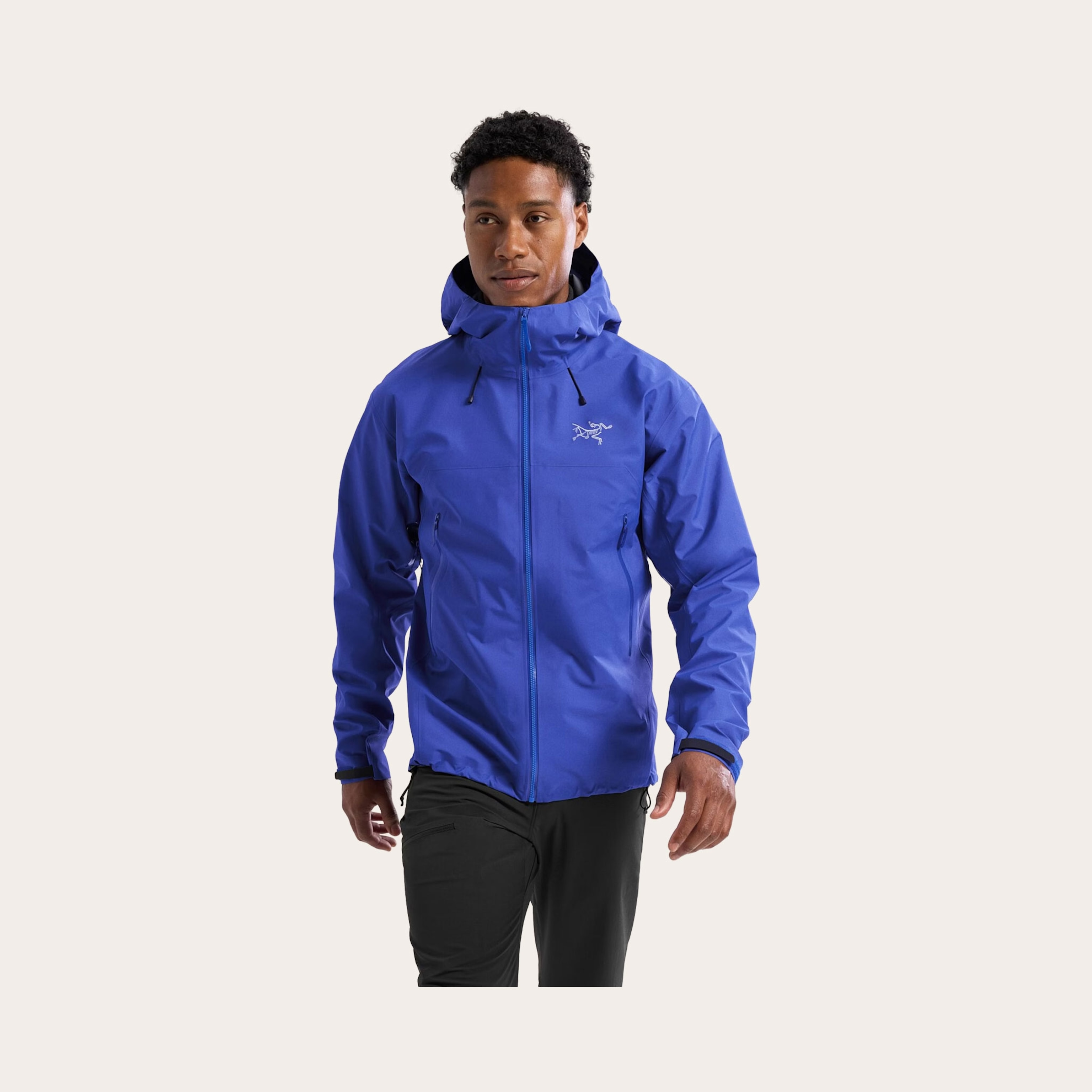 Man wearing a bright blue jacket.
