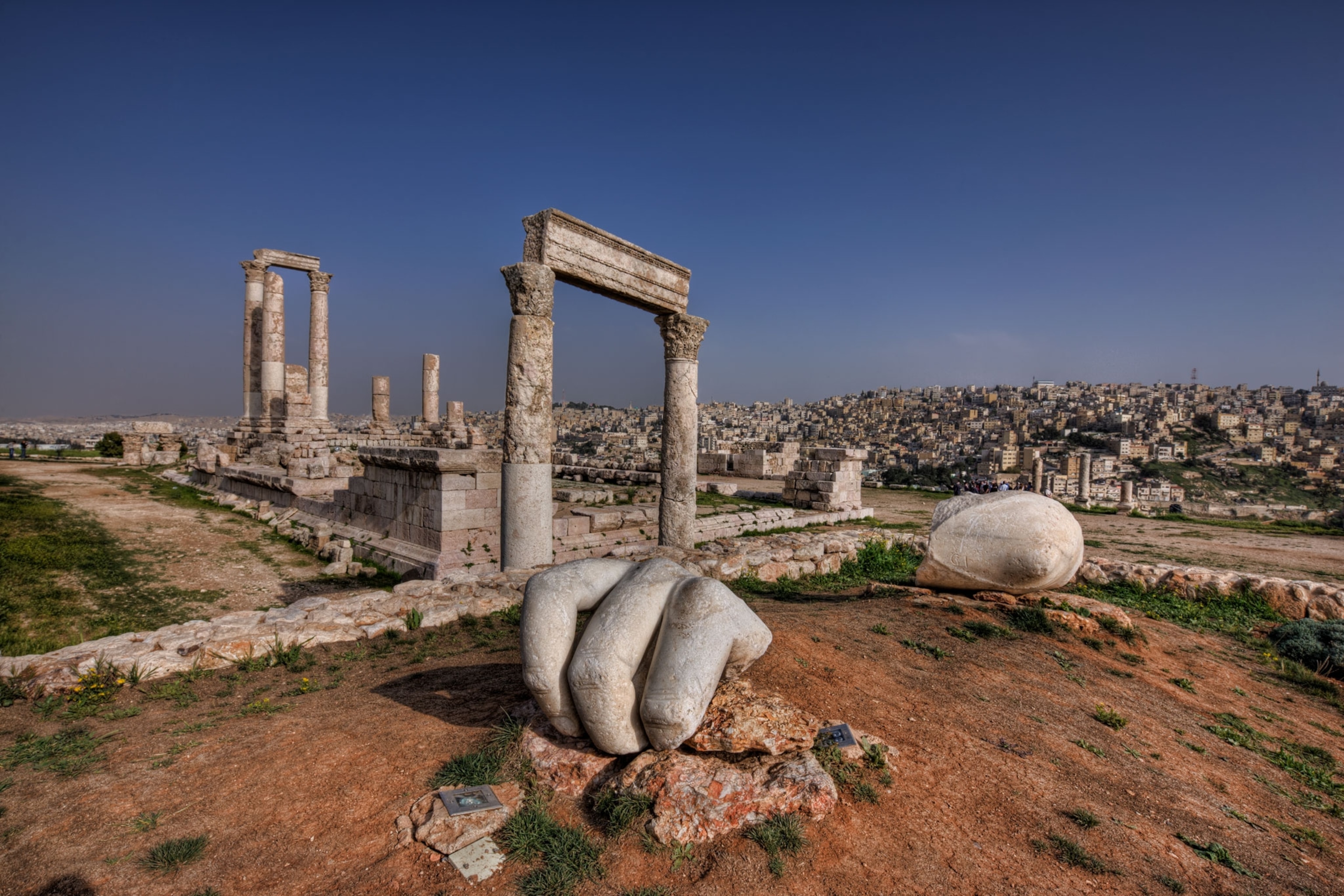 Ancient columns sit on top a hill overlooking the city of Amman.