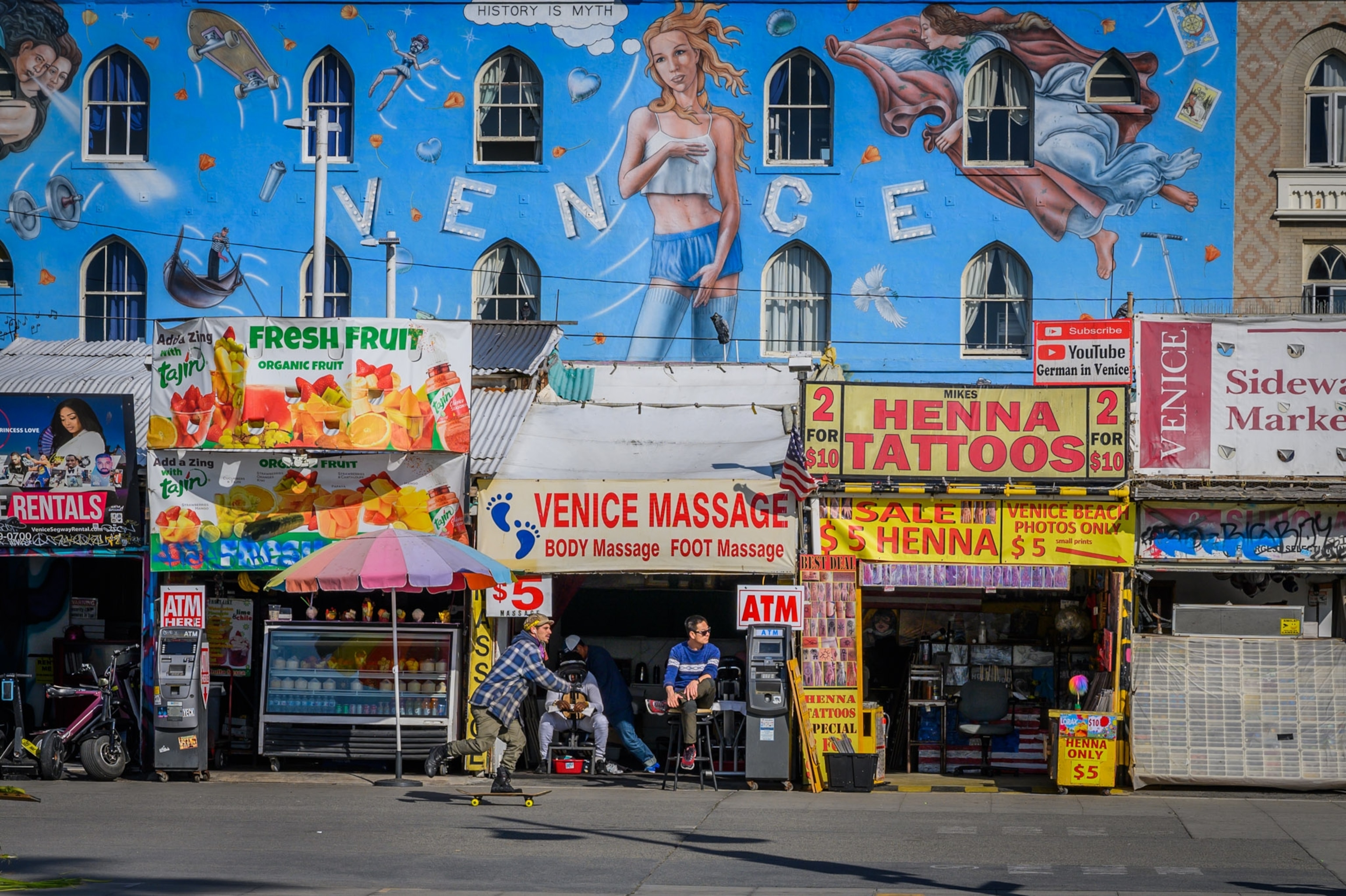 the boardwalk lined with shops in Venice, Beach California