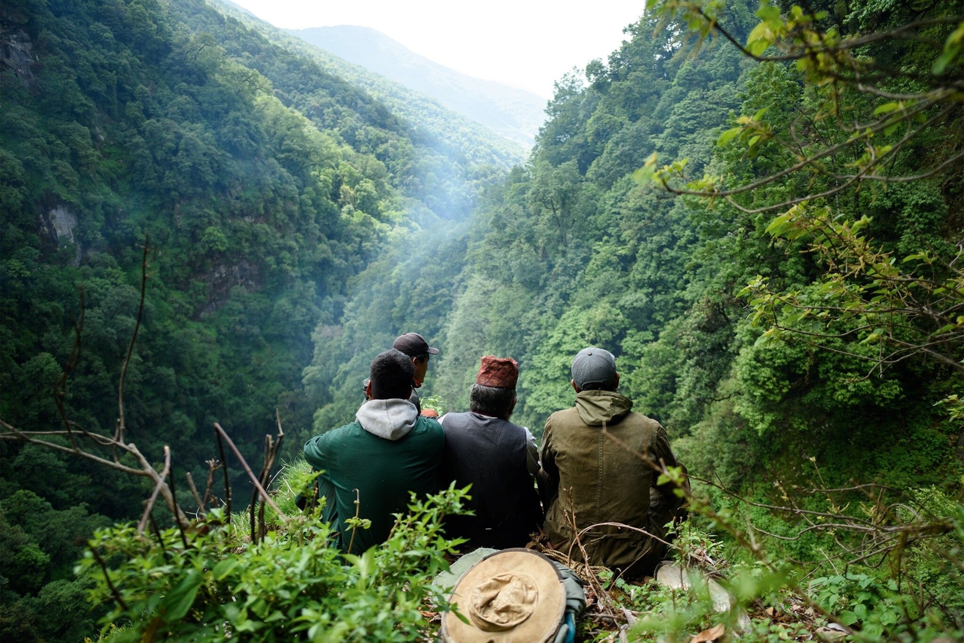 Senior honey hunters sit on the top of the hill and pay their respects to Mother Nature, requesting permission to collect honey from the hives. By doing this, they believe they’ll be protected from any danger they may have to face during the harvest.