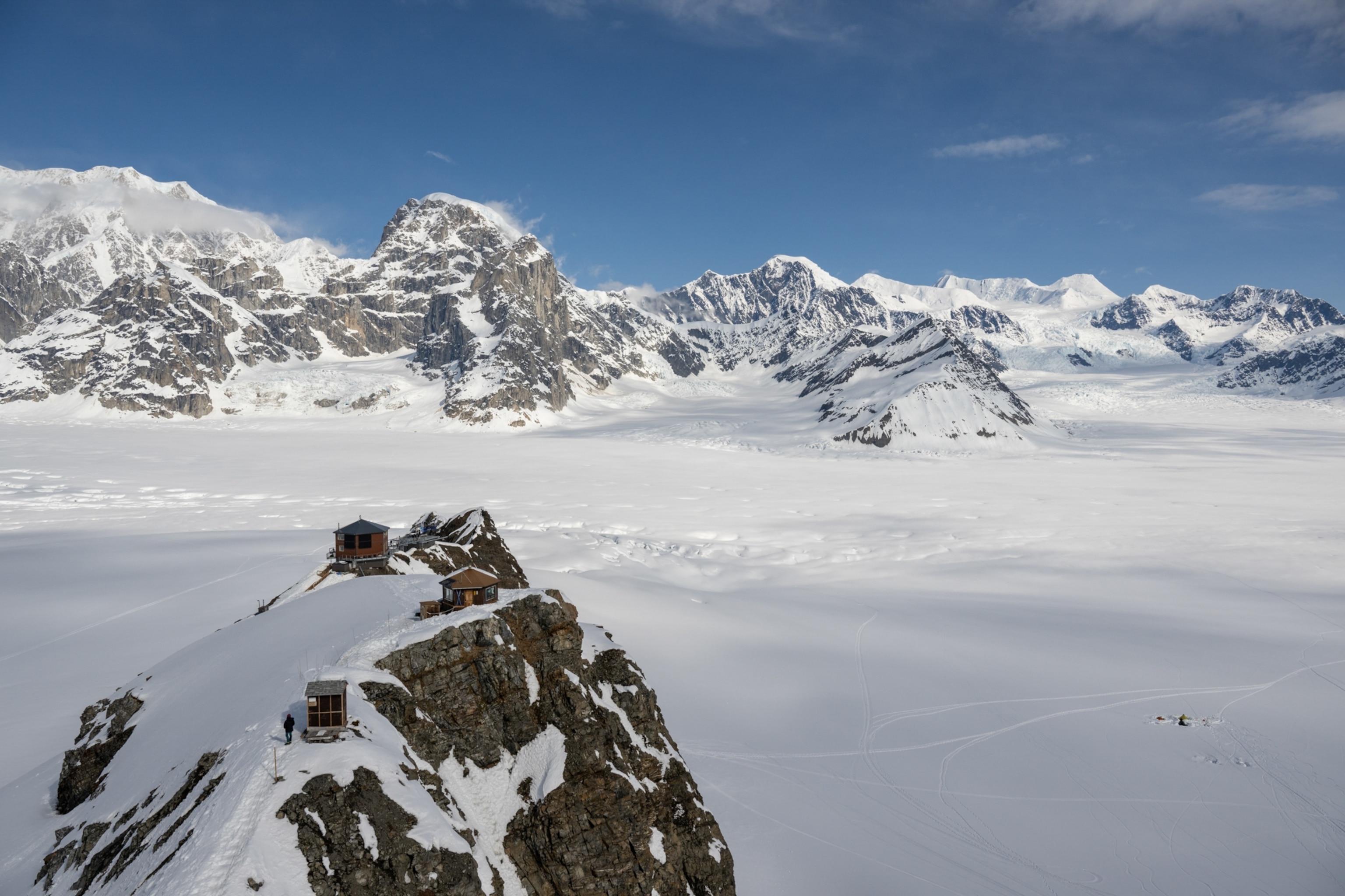 The small luxury cabins sit at the summit of a mountain